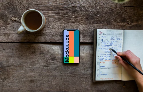 iPhone XS mockup on wooden table