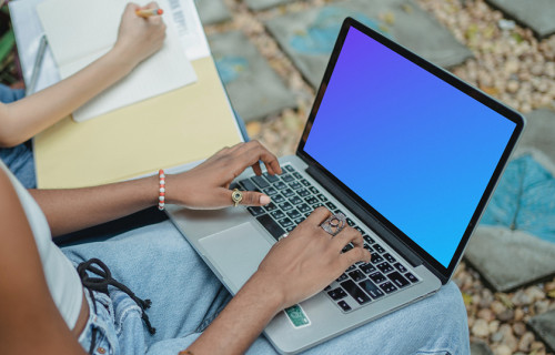 MacBook Pro mockup on a user's lap
