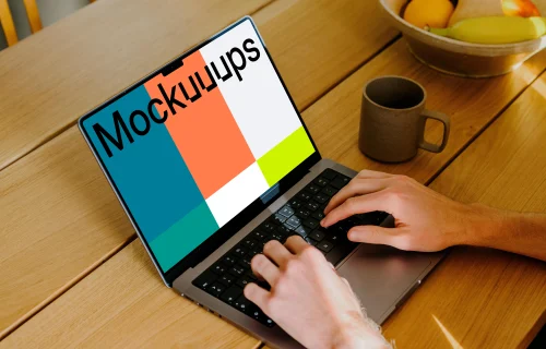 MacBook Pro mockup with a user typing on it.