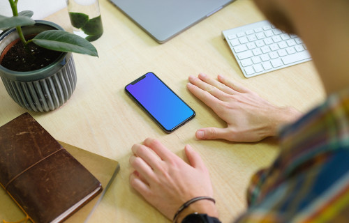 Man with iPhone 11 mockup in the office
