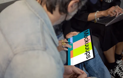 Microsoft Surface laptop mockup being used by two co-workers