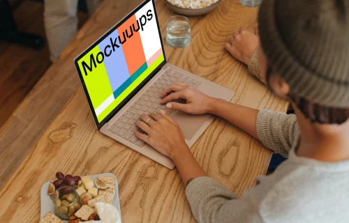 Microsoft Surface Laptop mockup with a platter of food at the side