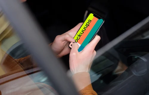 Over the shoulder view of passenger typing on iPhone 11 mockup