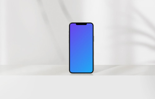 Simple iPhone mockup placed upright with a leaf in the foreground