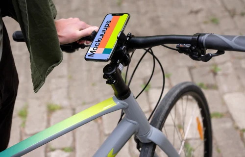 Sitting on a bike with iPhone Pro 11 mockup in bike mount