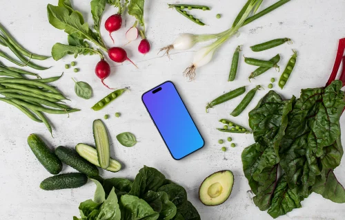 Smartphone mockup in the middle of vegetables