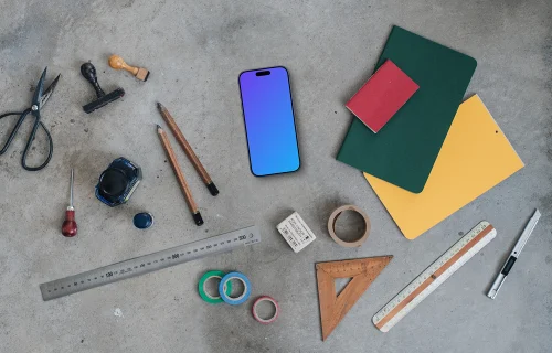 Smartphone mockup next to the colorful notebooks