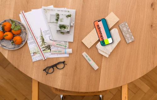 Smartphone mockup with architect's blueprint and tools