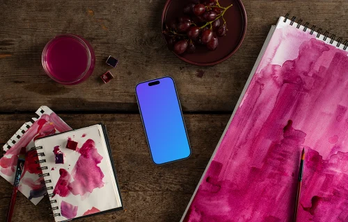 Smartphone with watercolor painting in Viva Magenta shade