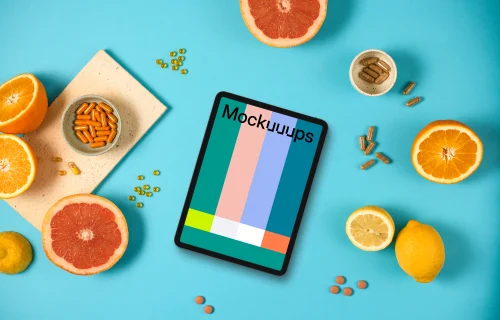 Tablet mockup with oranges and pills