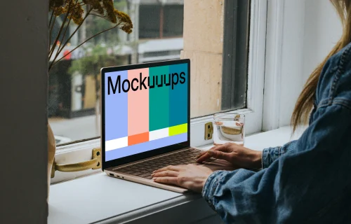 Woman sitting and working on the Microsoft Surface Laptop mockup