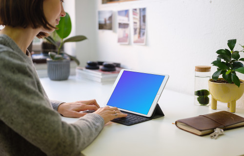 Young woman working on the iPad Pro mockup