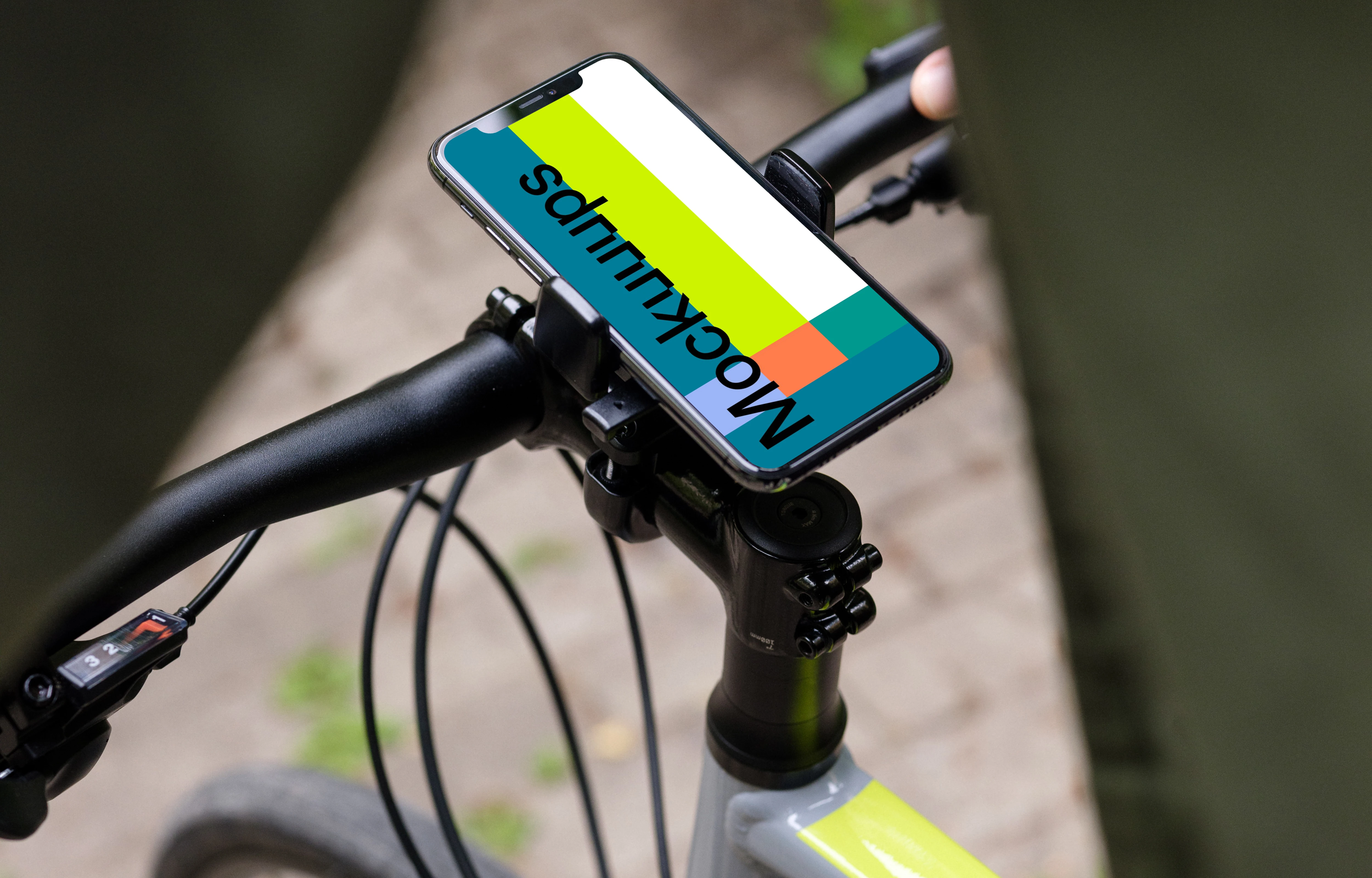 Front view of iPhone 11 Pro mockup in bike mount while riding