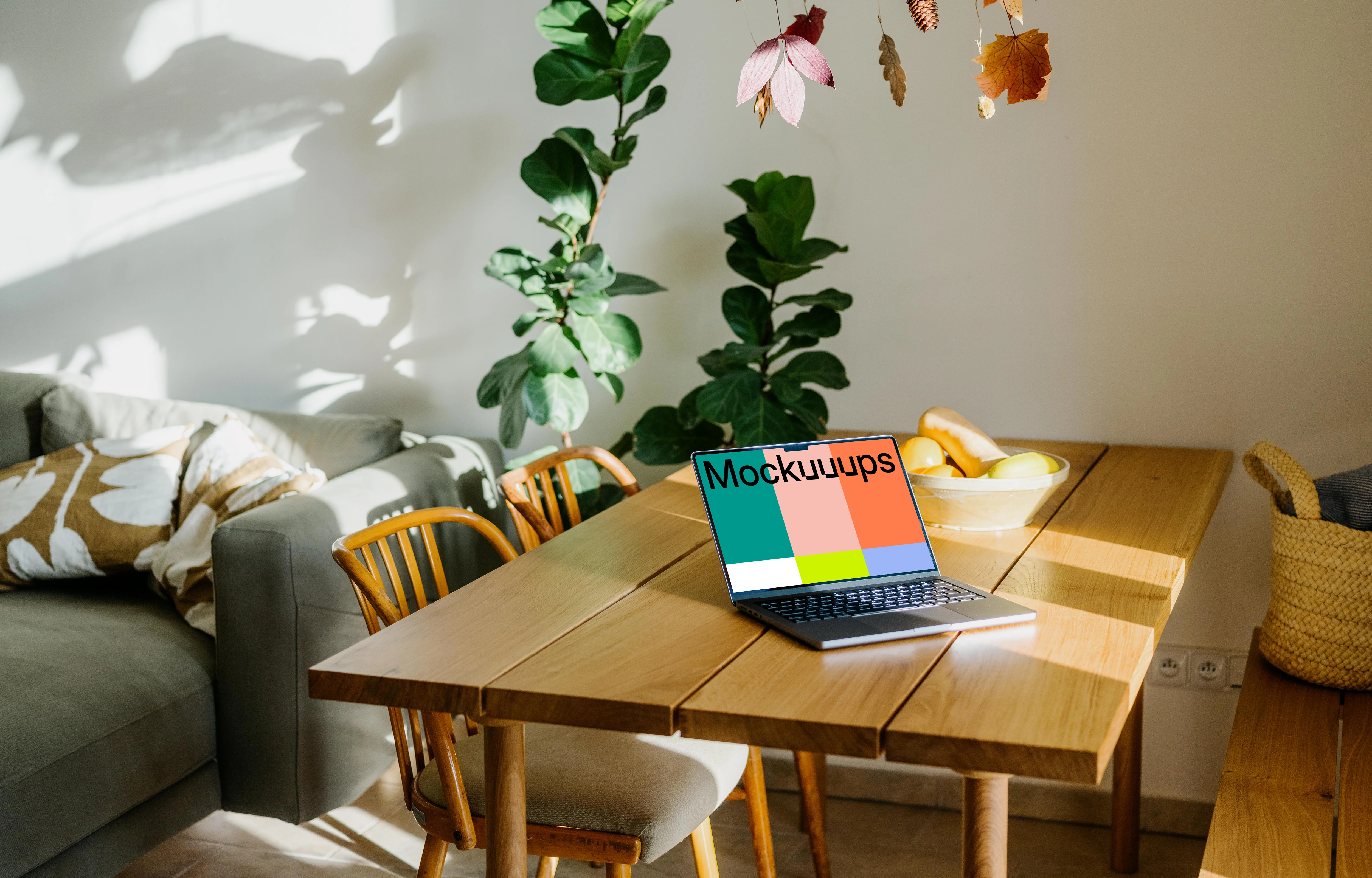 Grey MacBook Pro mockup on a table in a living room