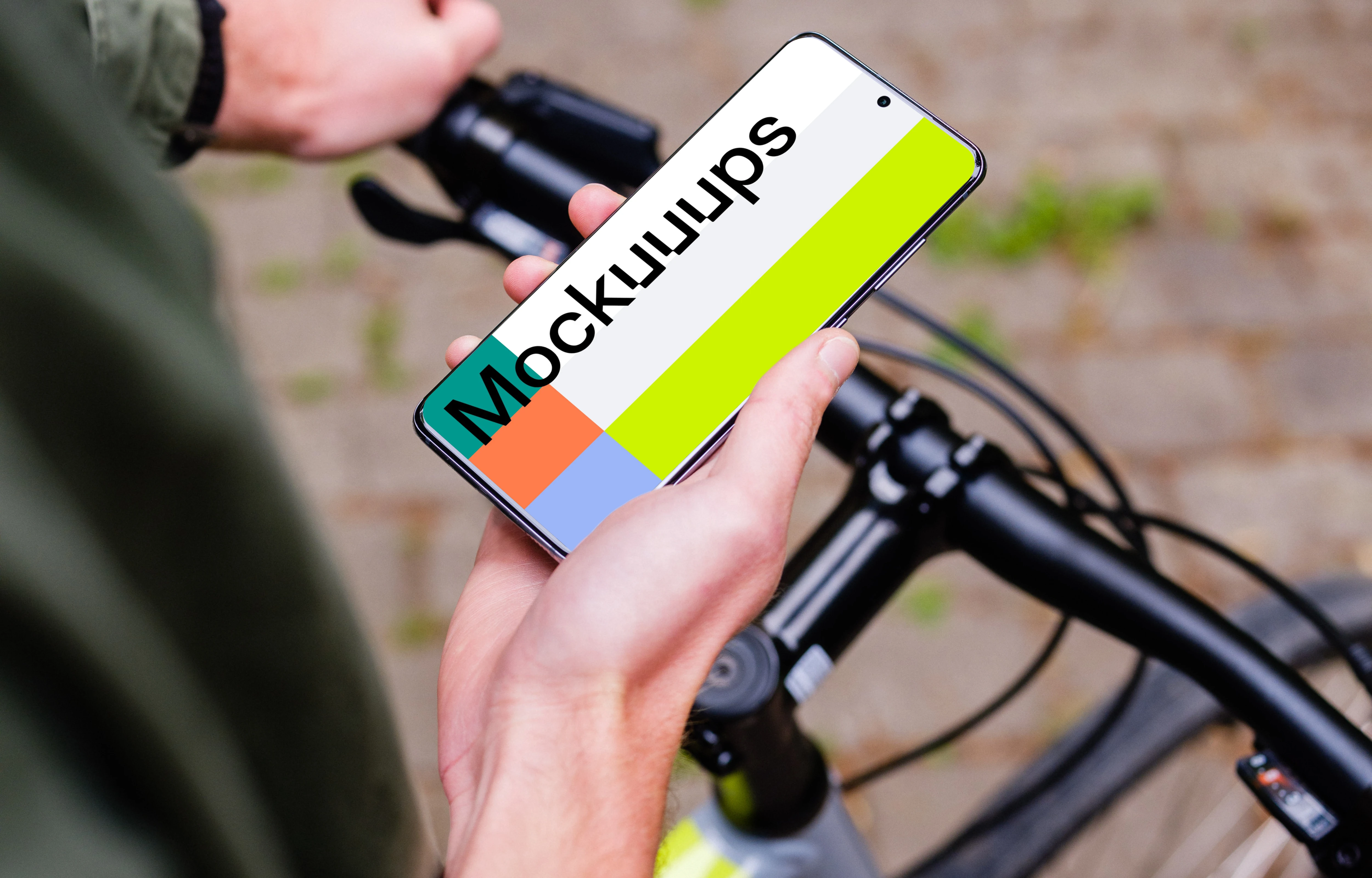 Holding bike in one hand with Samsung S20 mockup in the other