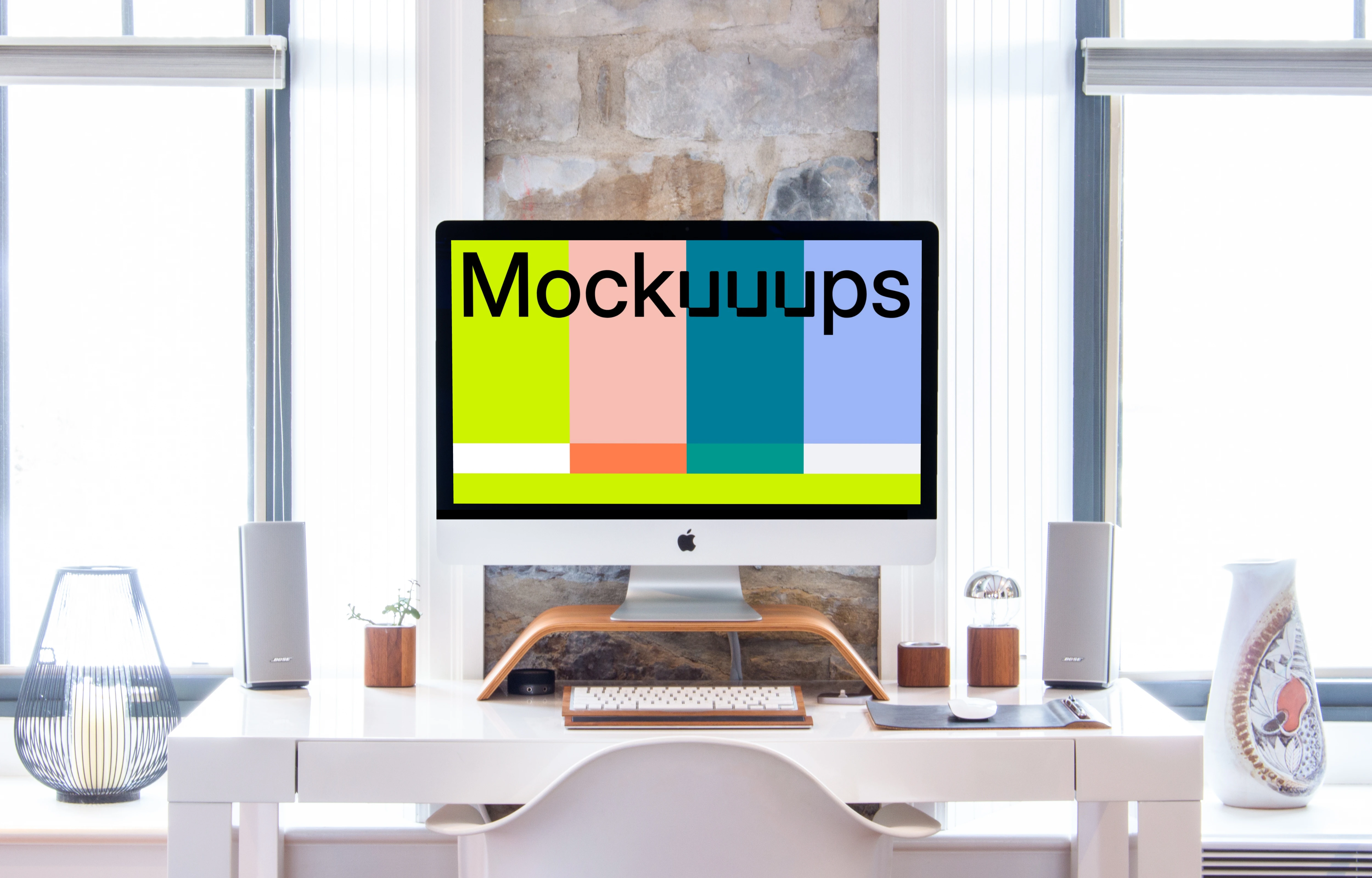 iMac mockup on a table with a keyboard and a mouse 