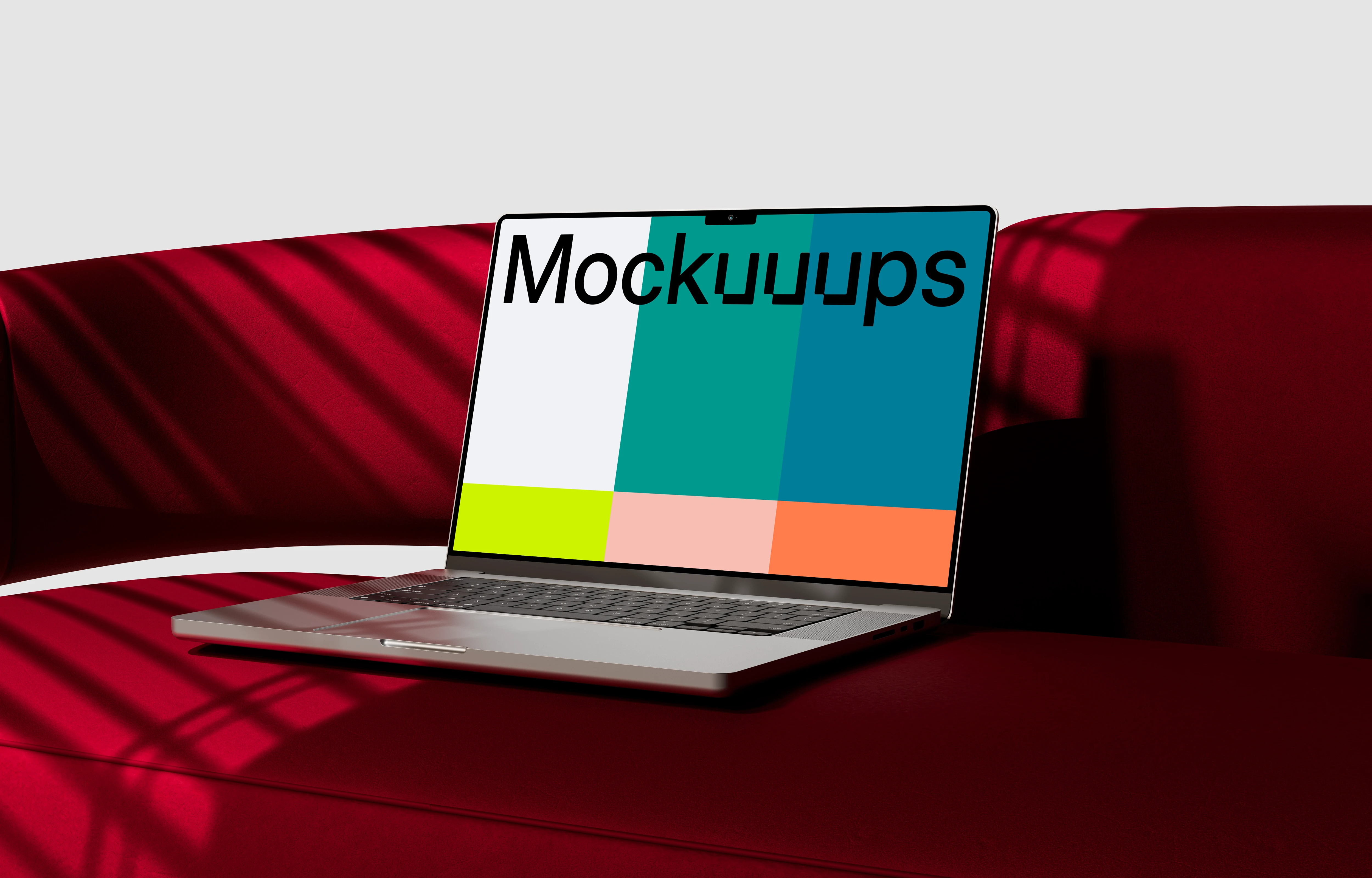 MacBook Pro mockup on a modern red sofa