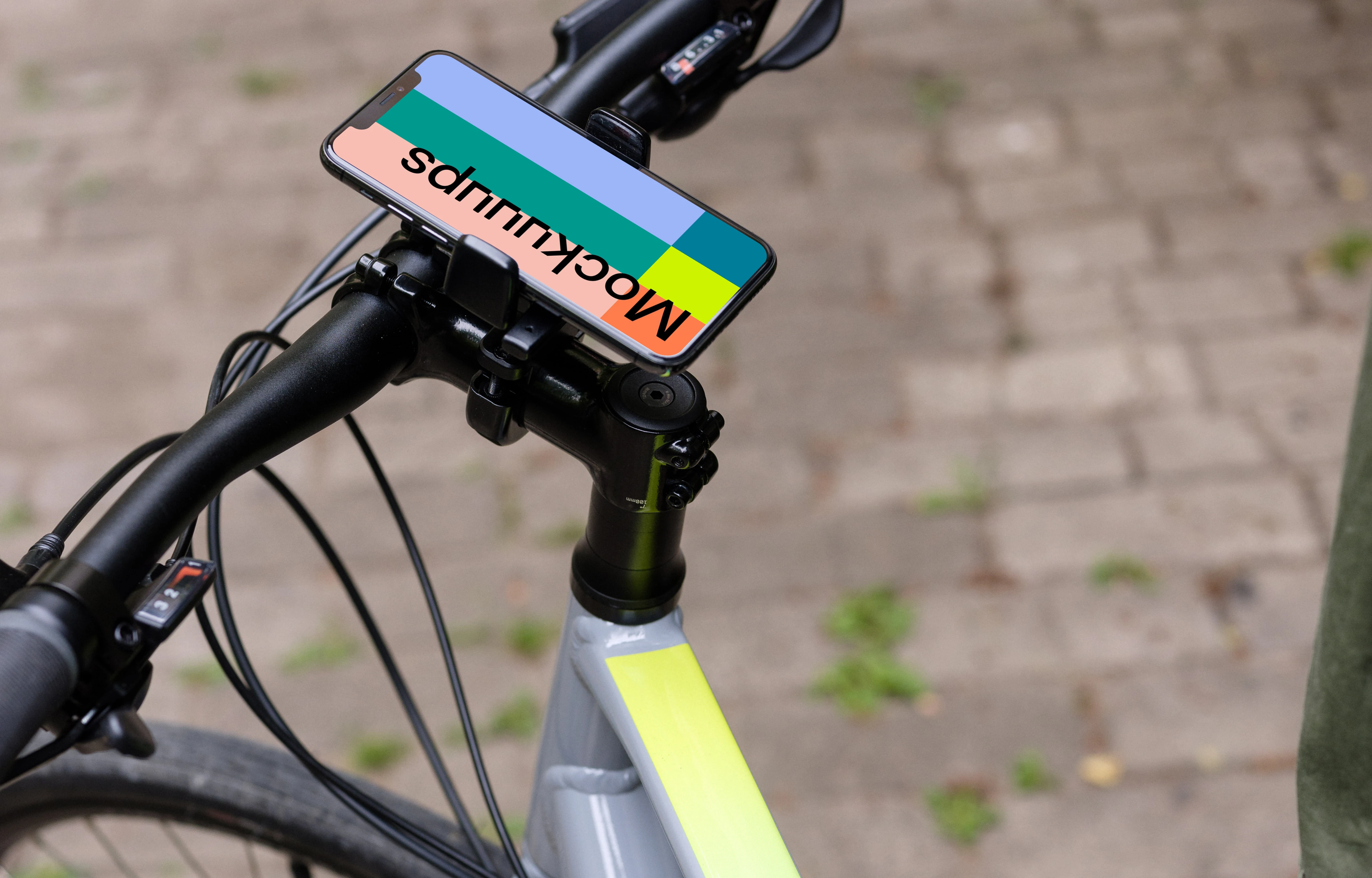 Man sat on a bike with iPhone 11 Pro mockup in bike mount