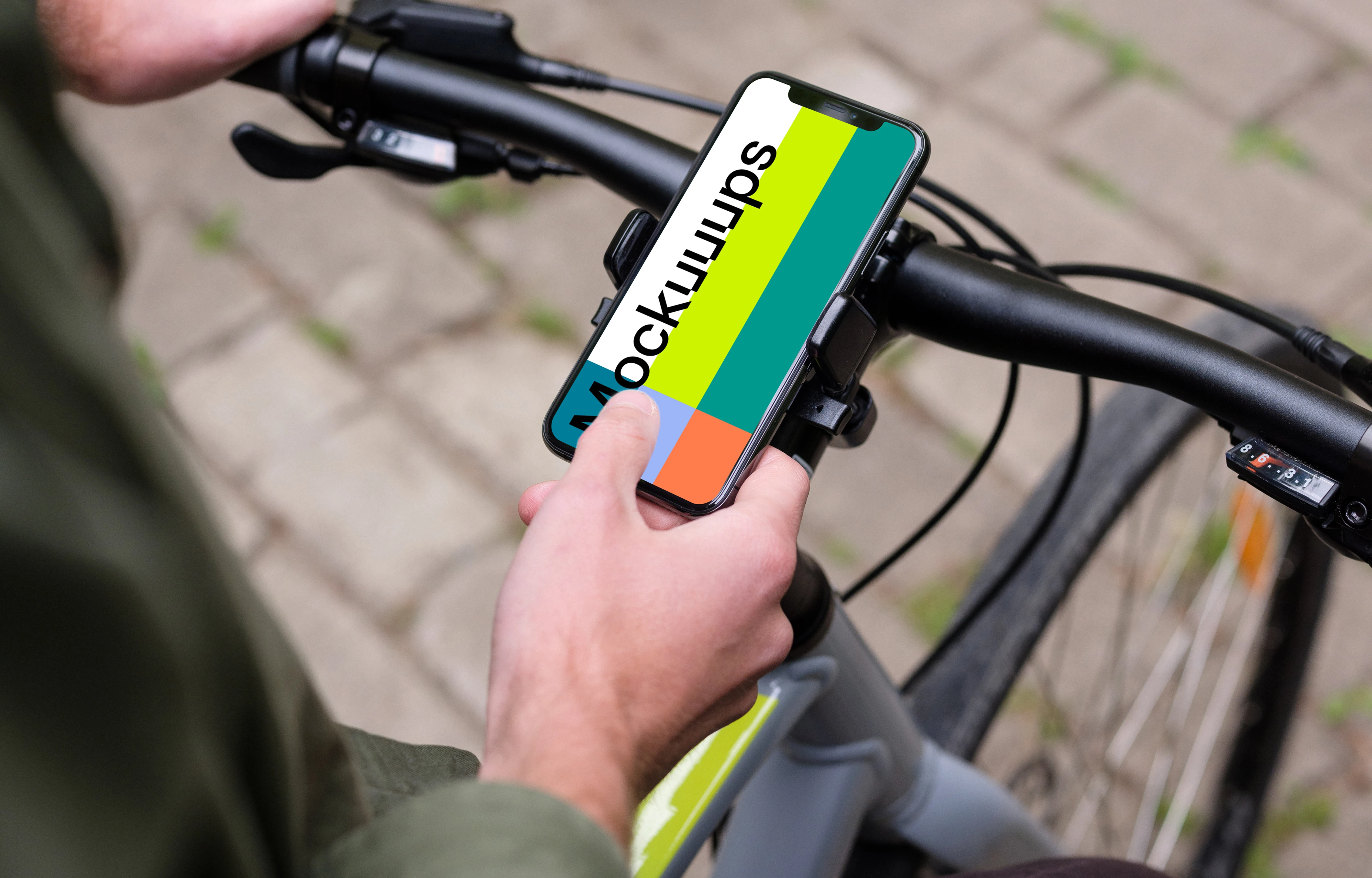 Sitting on bike tapping the iPhone 11 Pro mockup in bike mount
