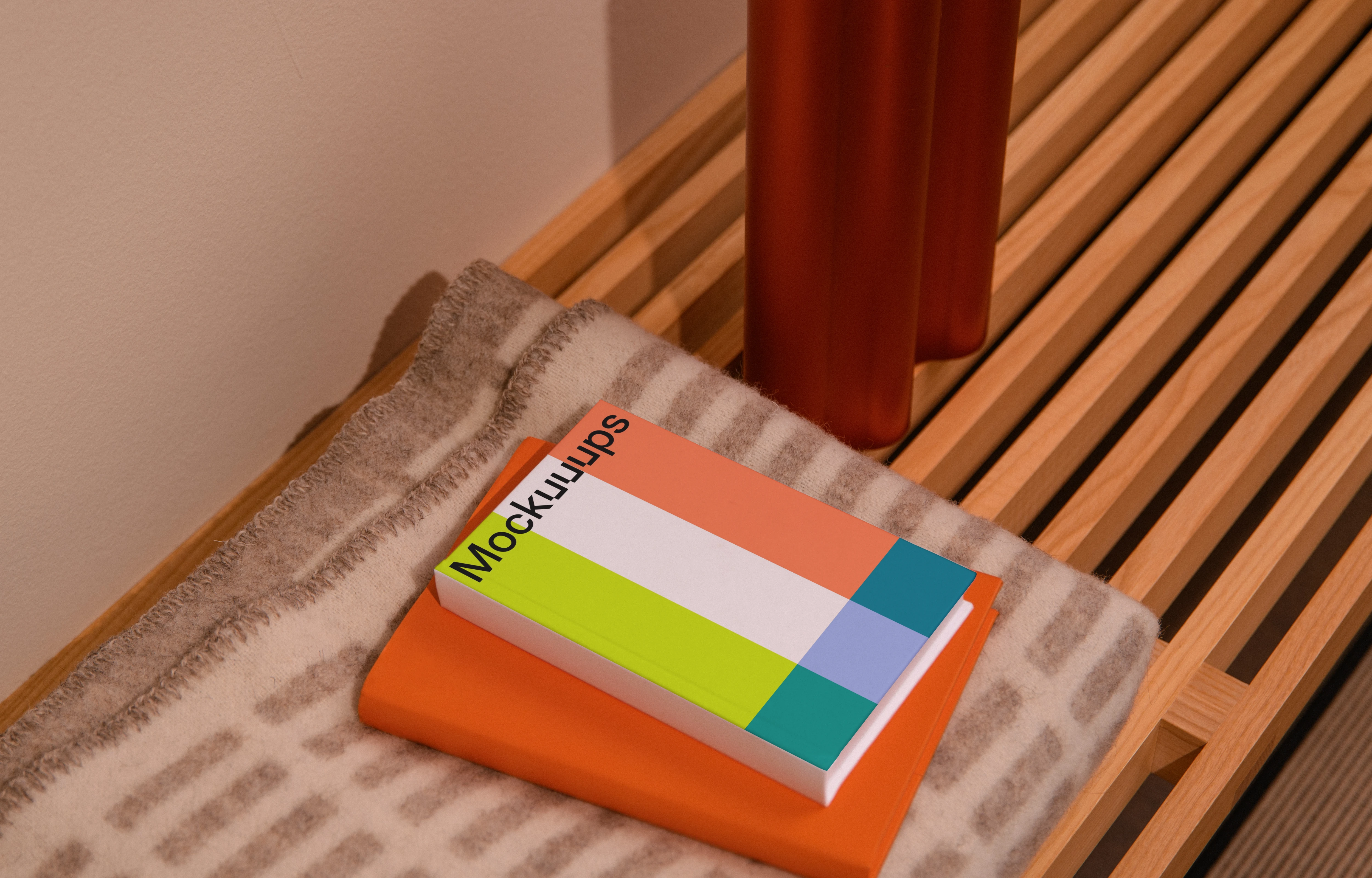 A-format book mockup on a wooden bench with decor