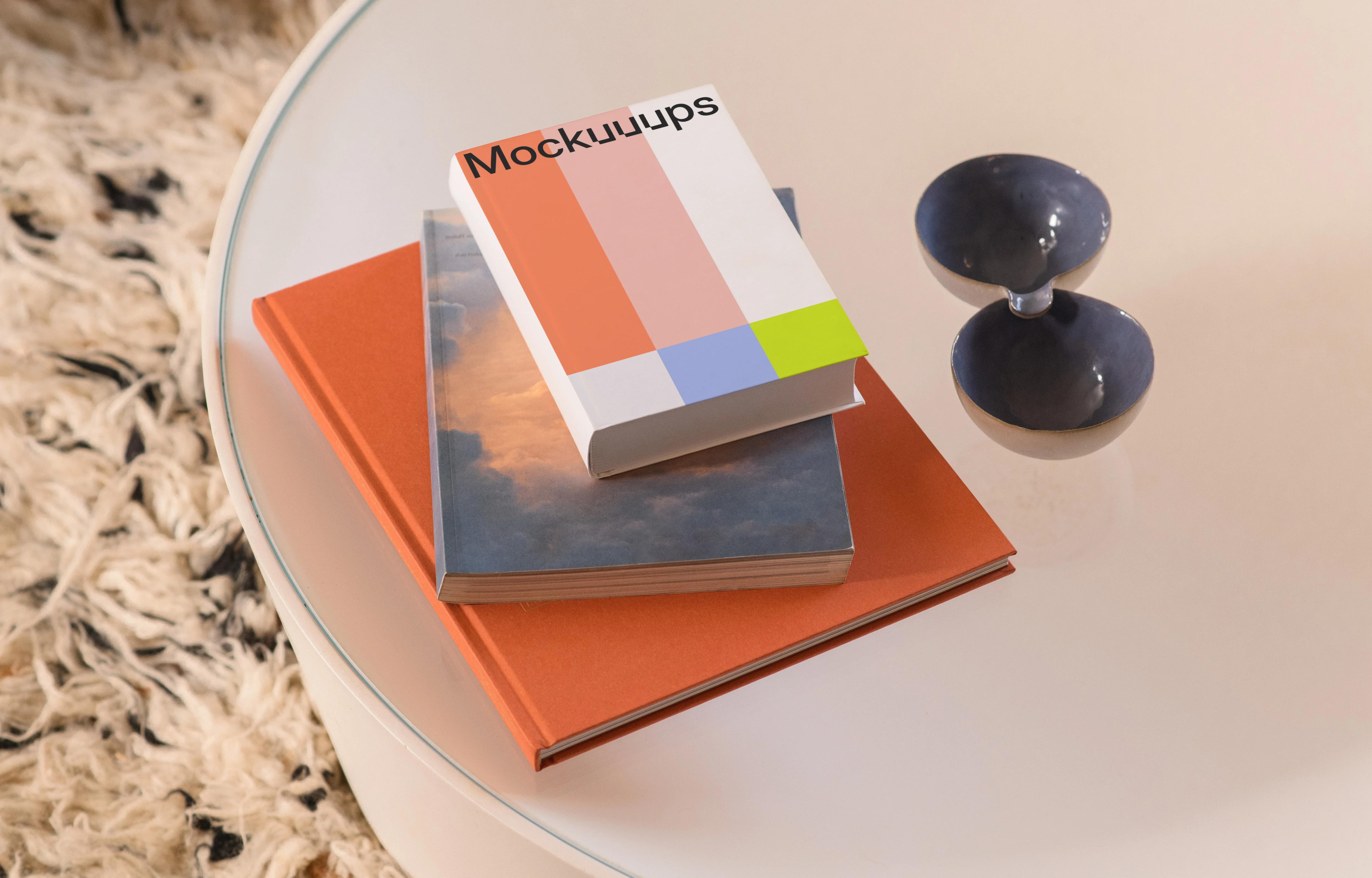 B-format book mockup on a glass table with decor