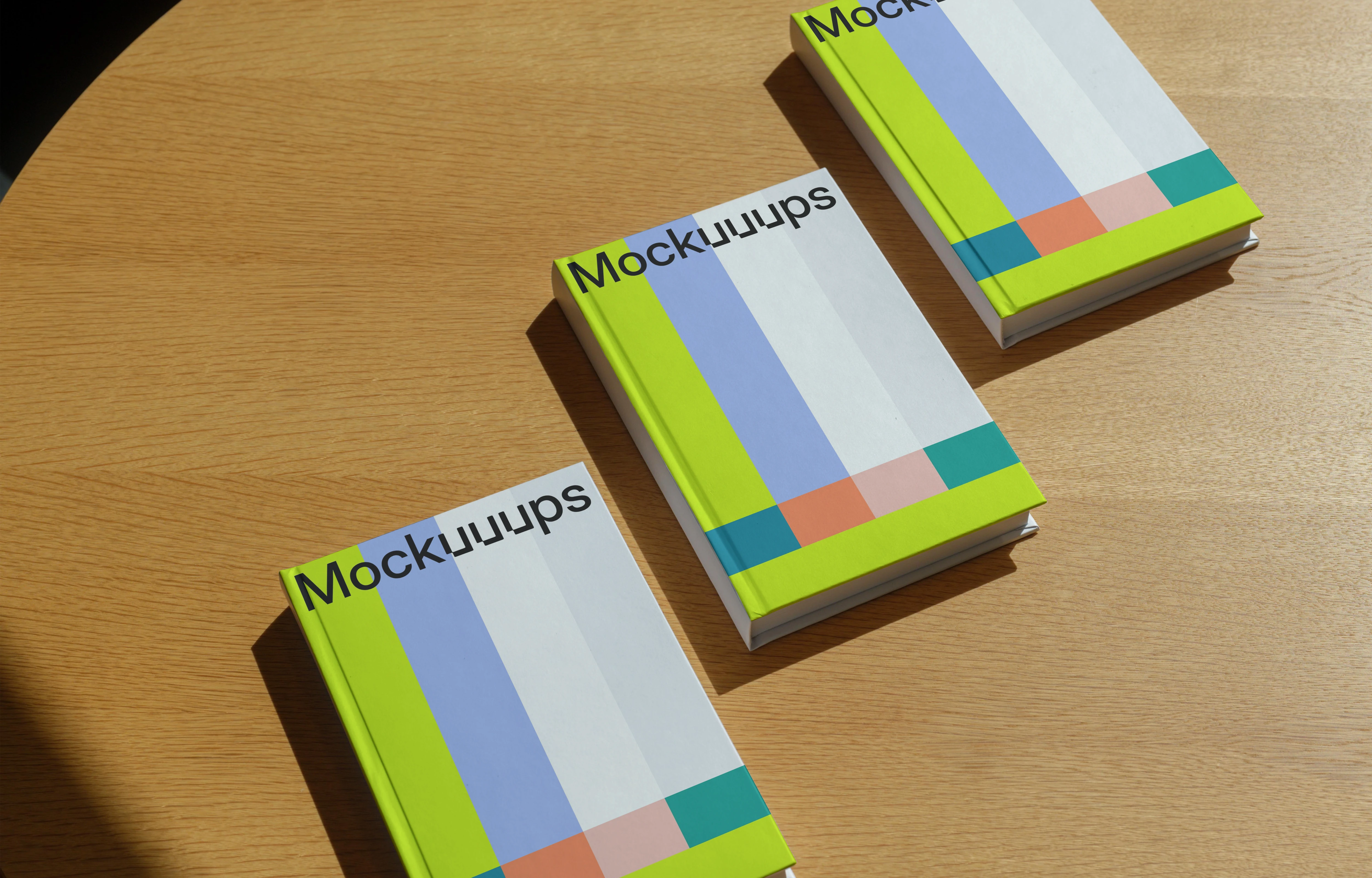 B-format book mockup on a round wooden table in natural light