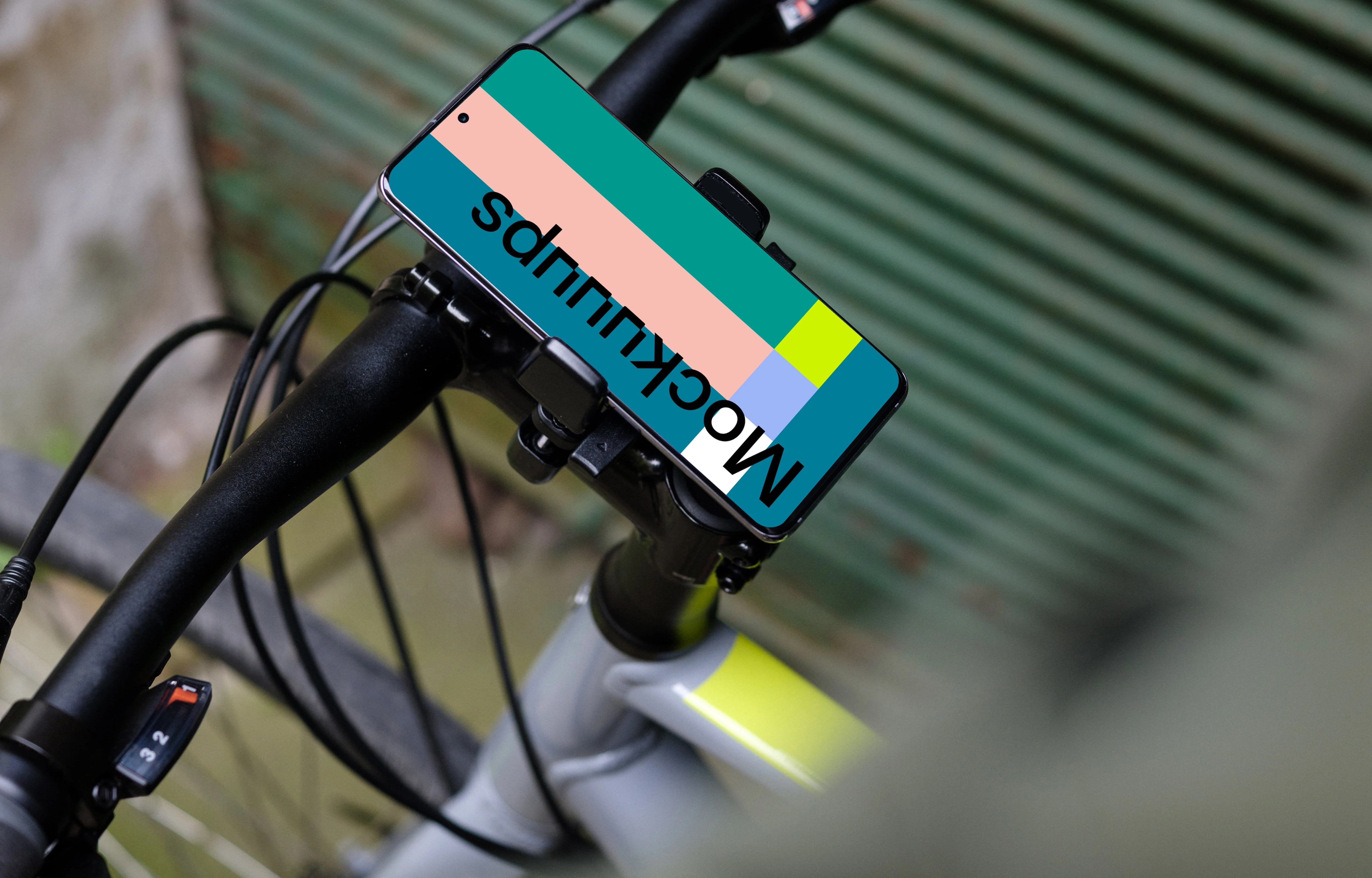 Bike next to a garage door with Samsung S20 mockup in bike mount