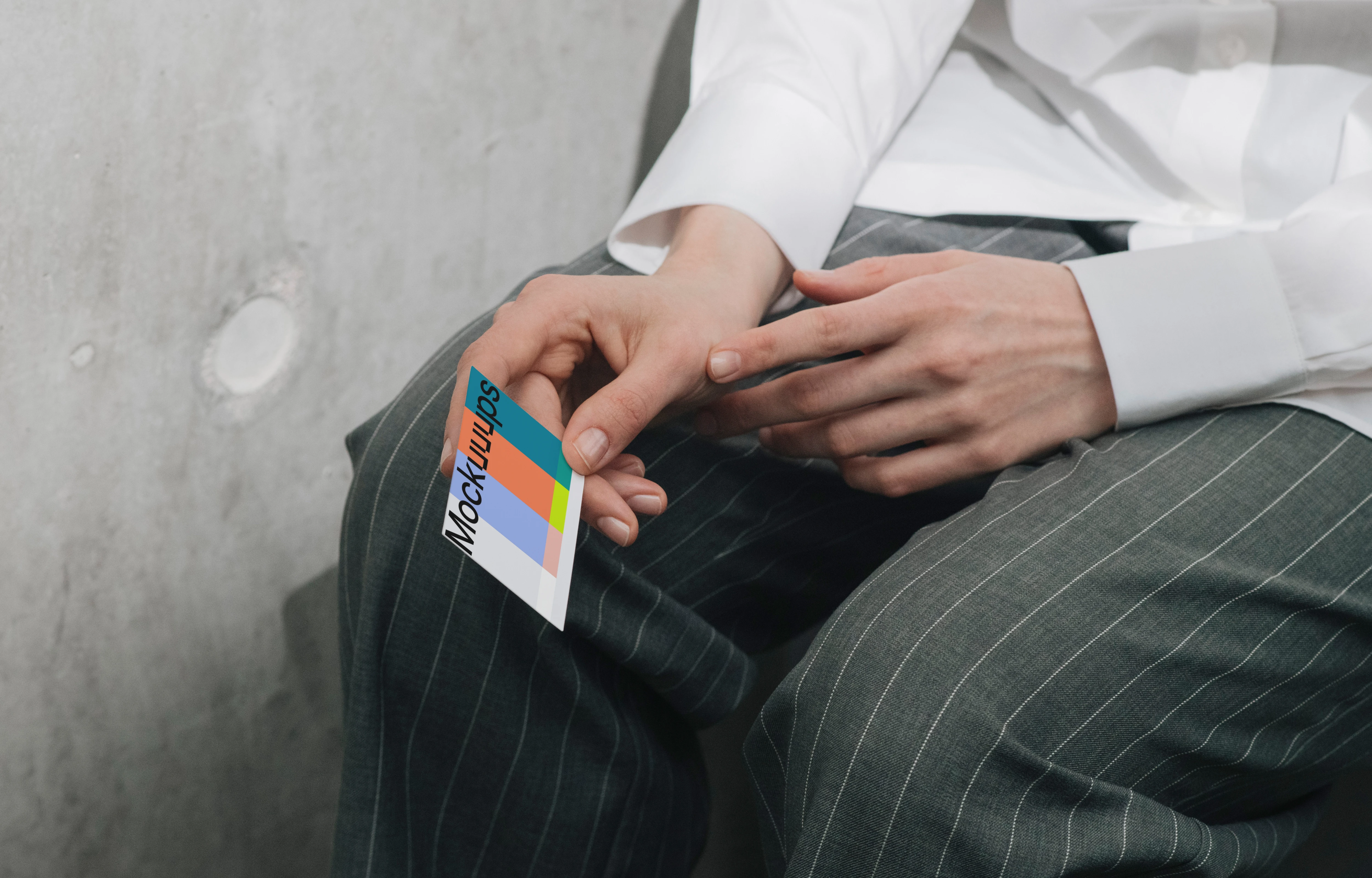 Business card mockup in hand with casual attire