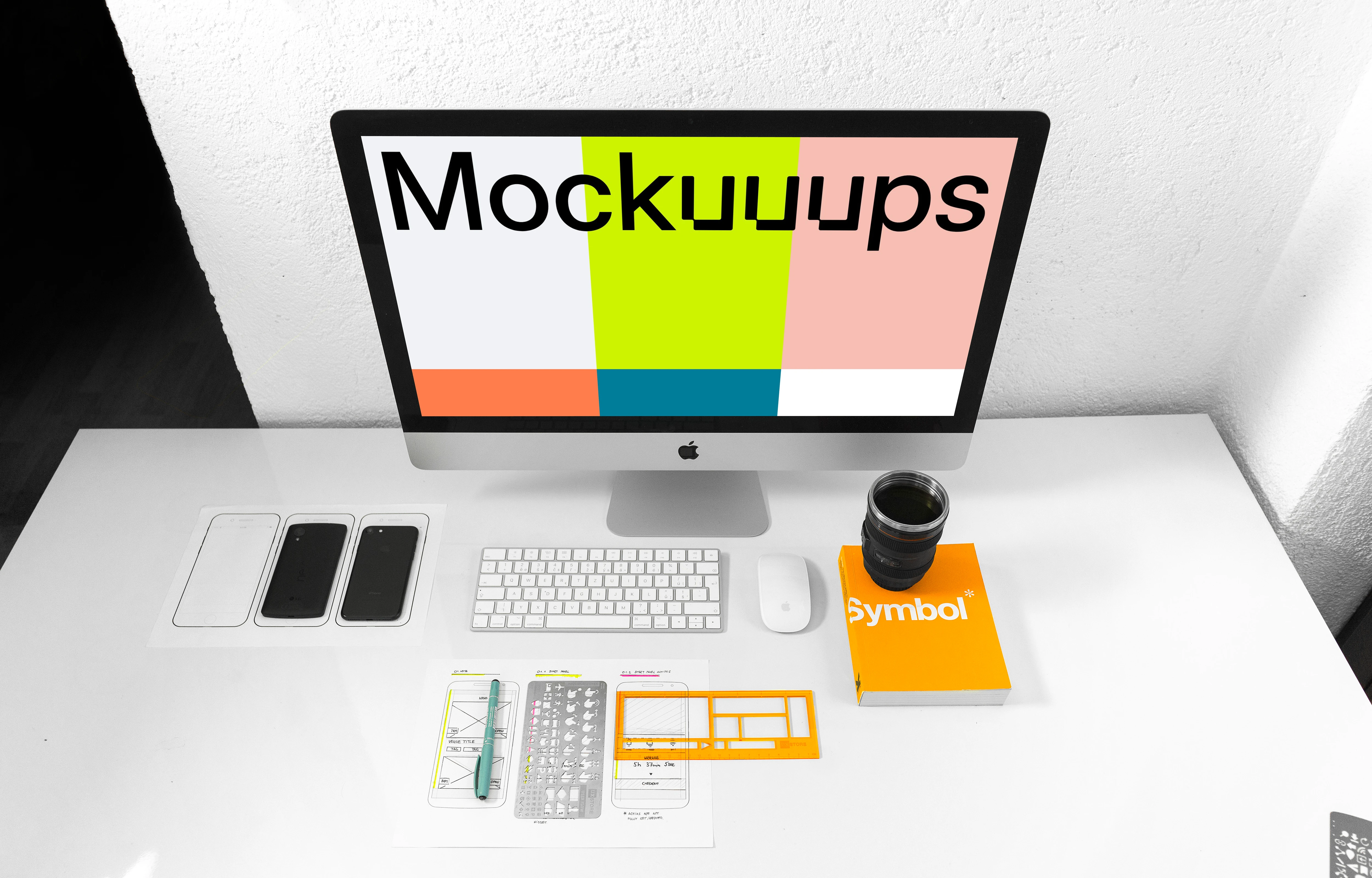 Front view of iMac mockup on white working desk