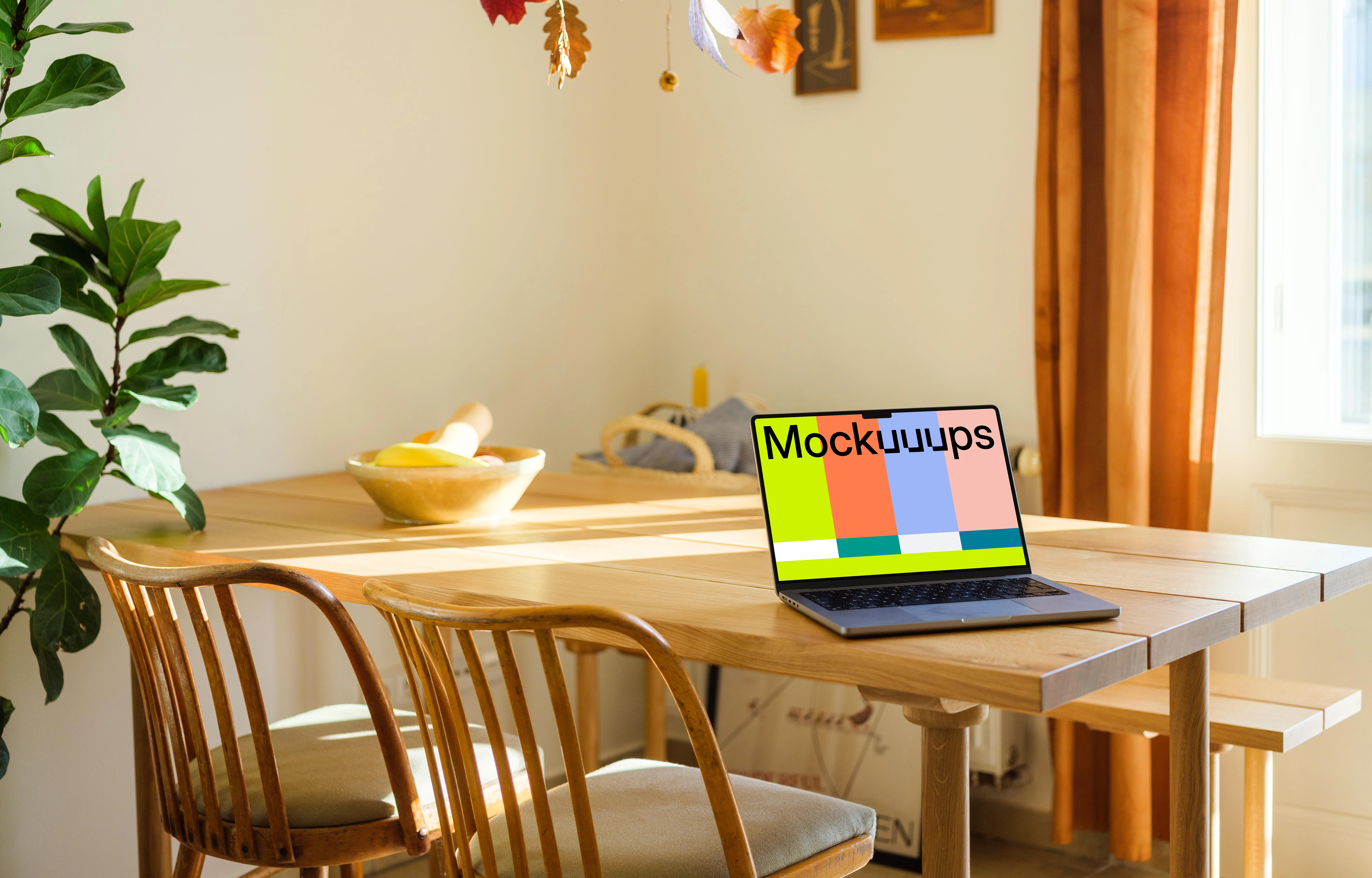 Grey MacBook Pro mockup on a dining table
