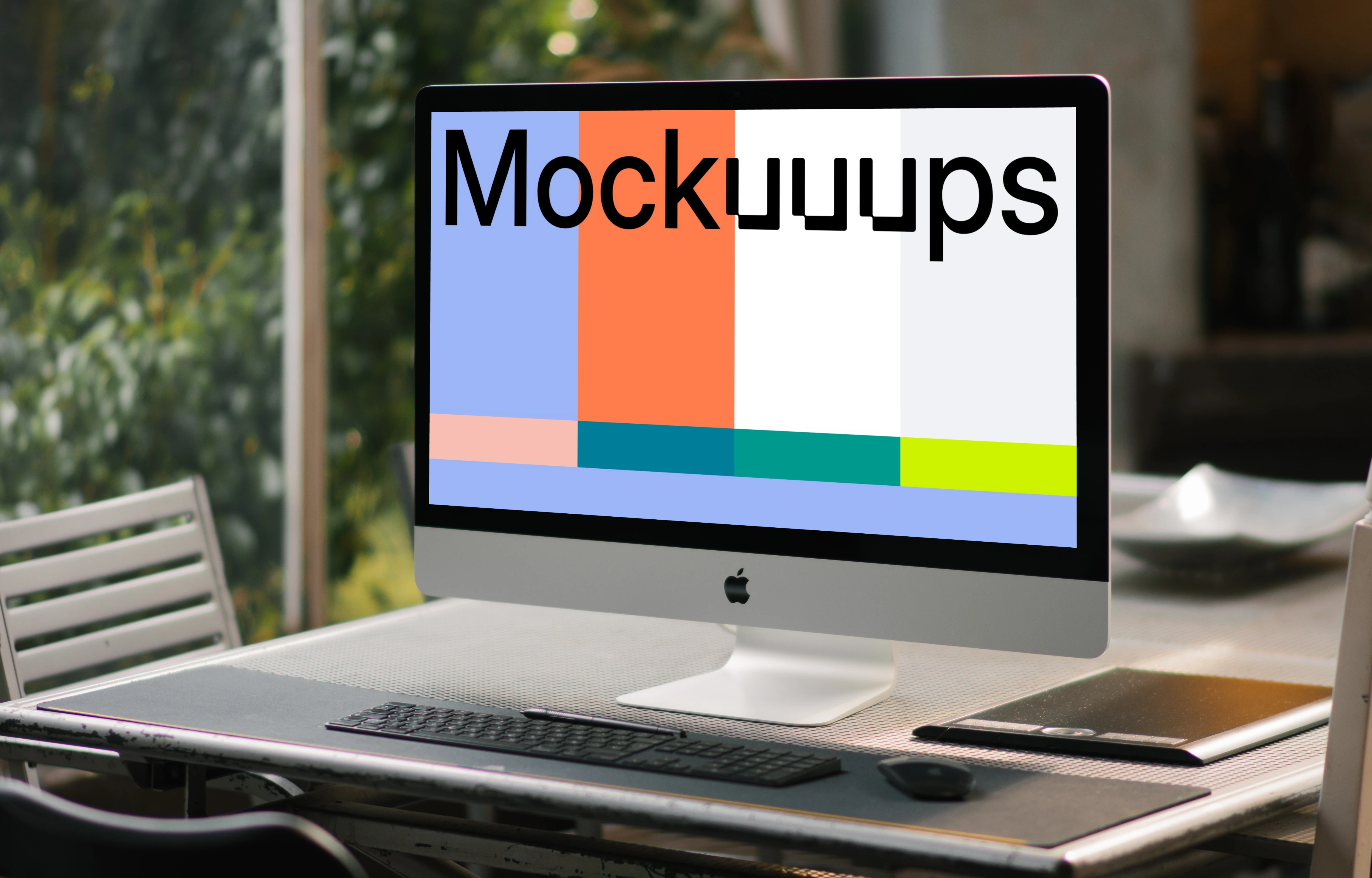 iMac mockup on a conference table