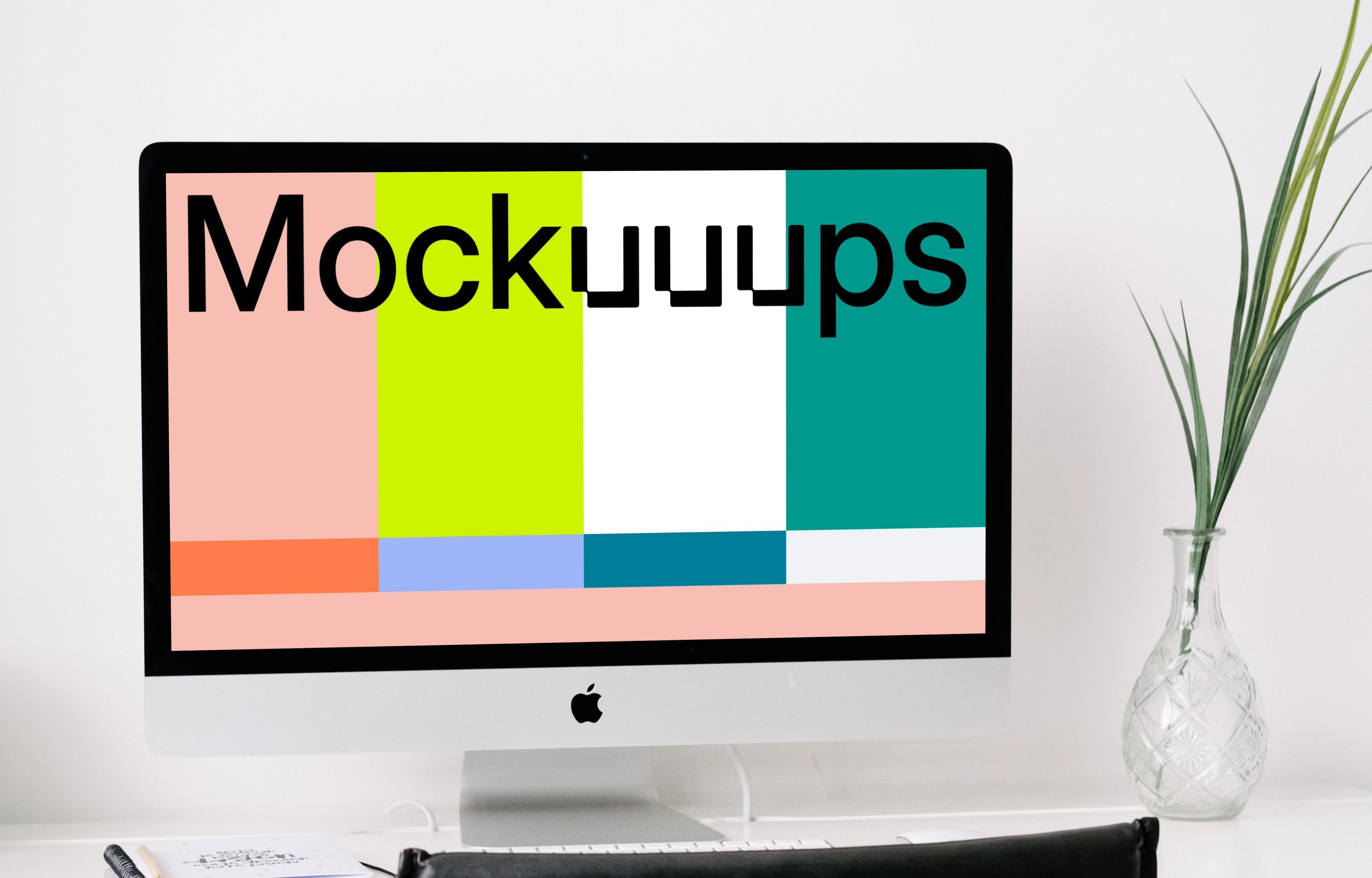 iMac mockup on a table with a black chair