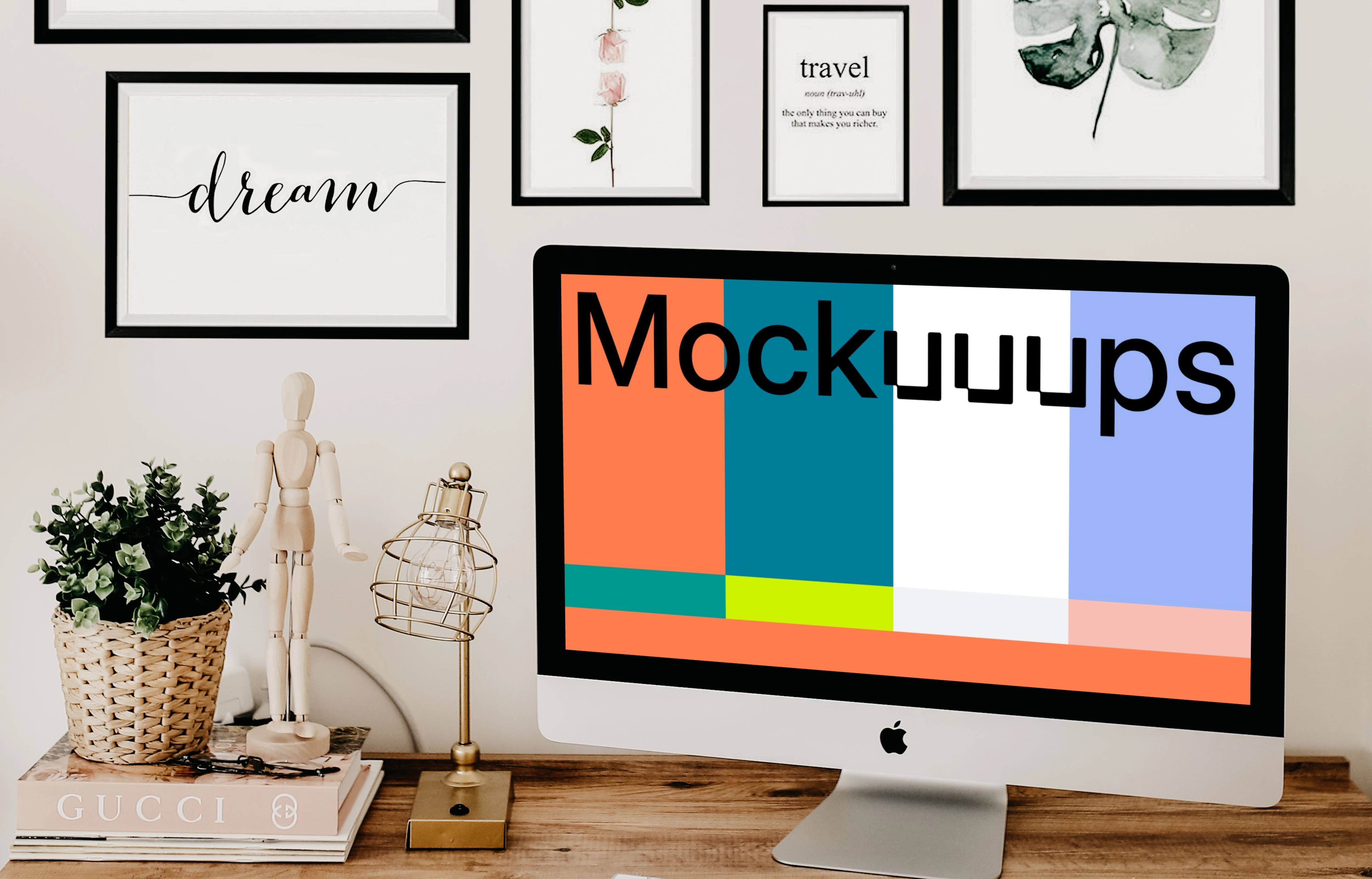  iMac mockup on a table with artwork in the background