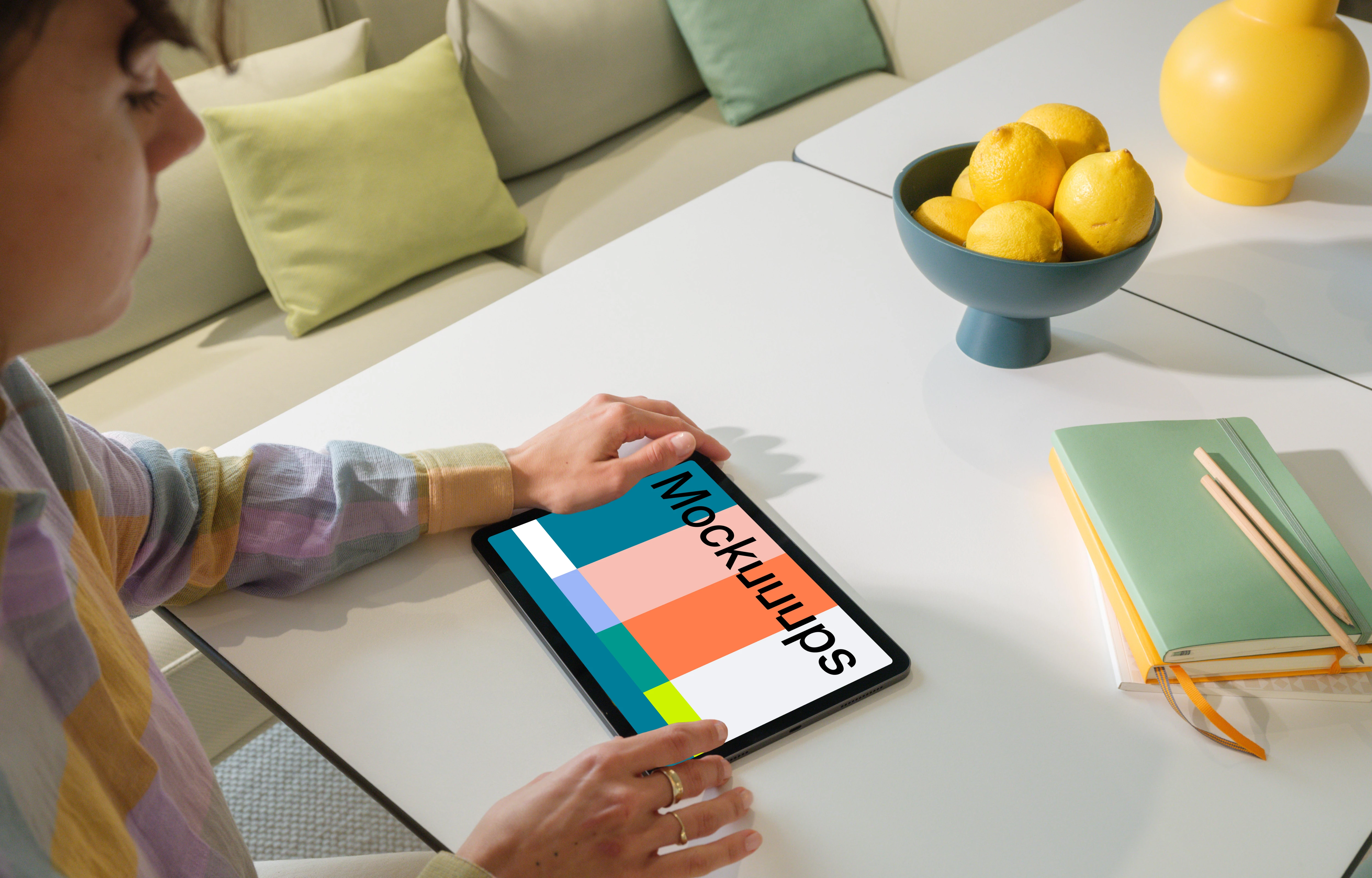 iPad Air Mockup in a Woman's Hand in a Bright Living Room