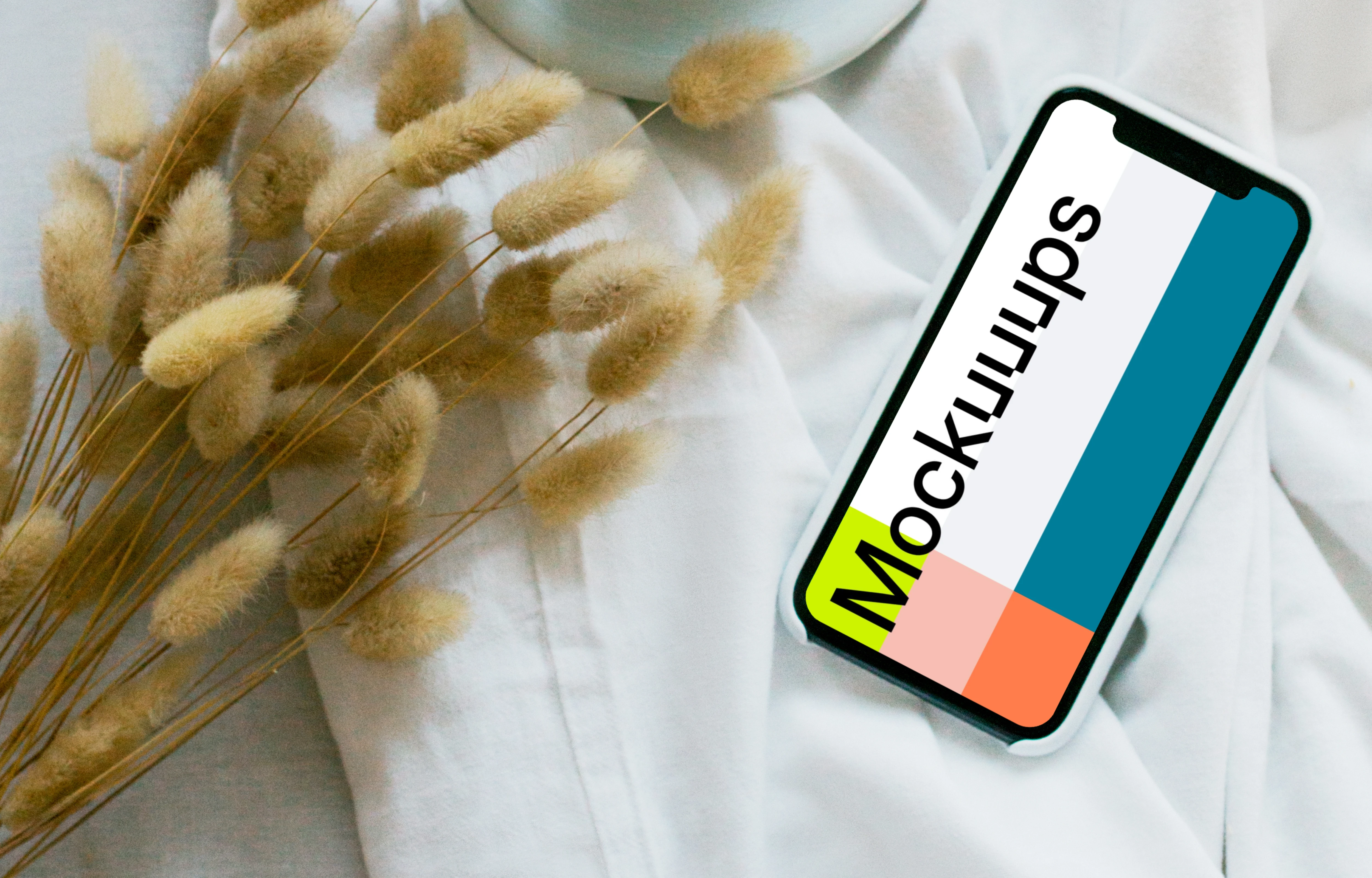 iPhone 12 mockup with a cup of coffee