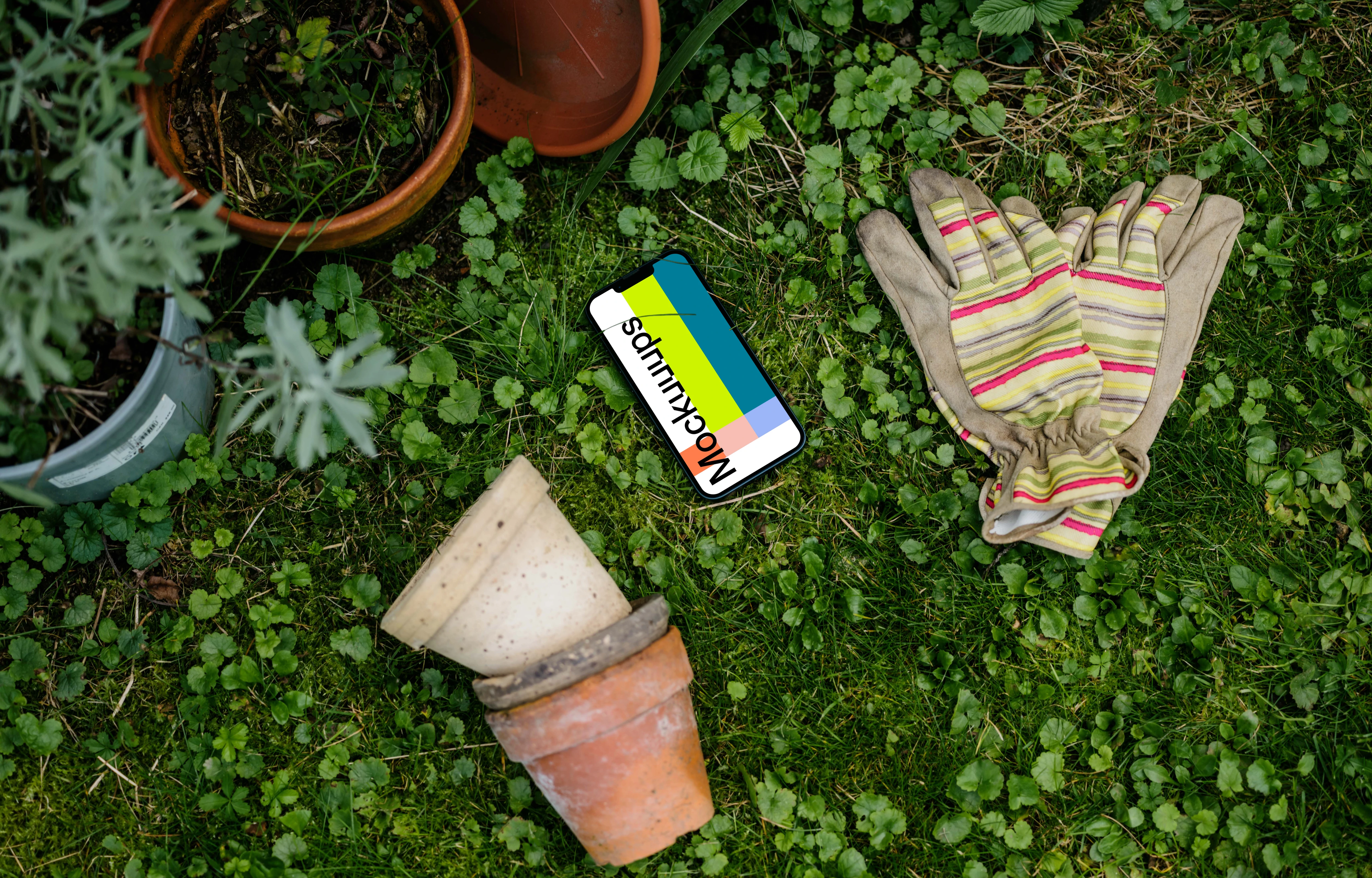 iPhone 13 mockup in garden