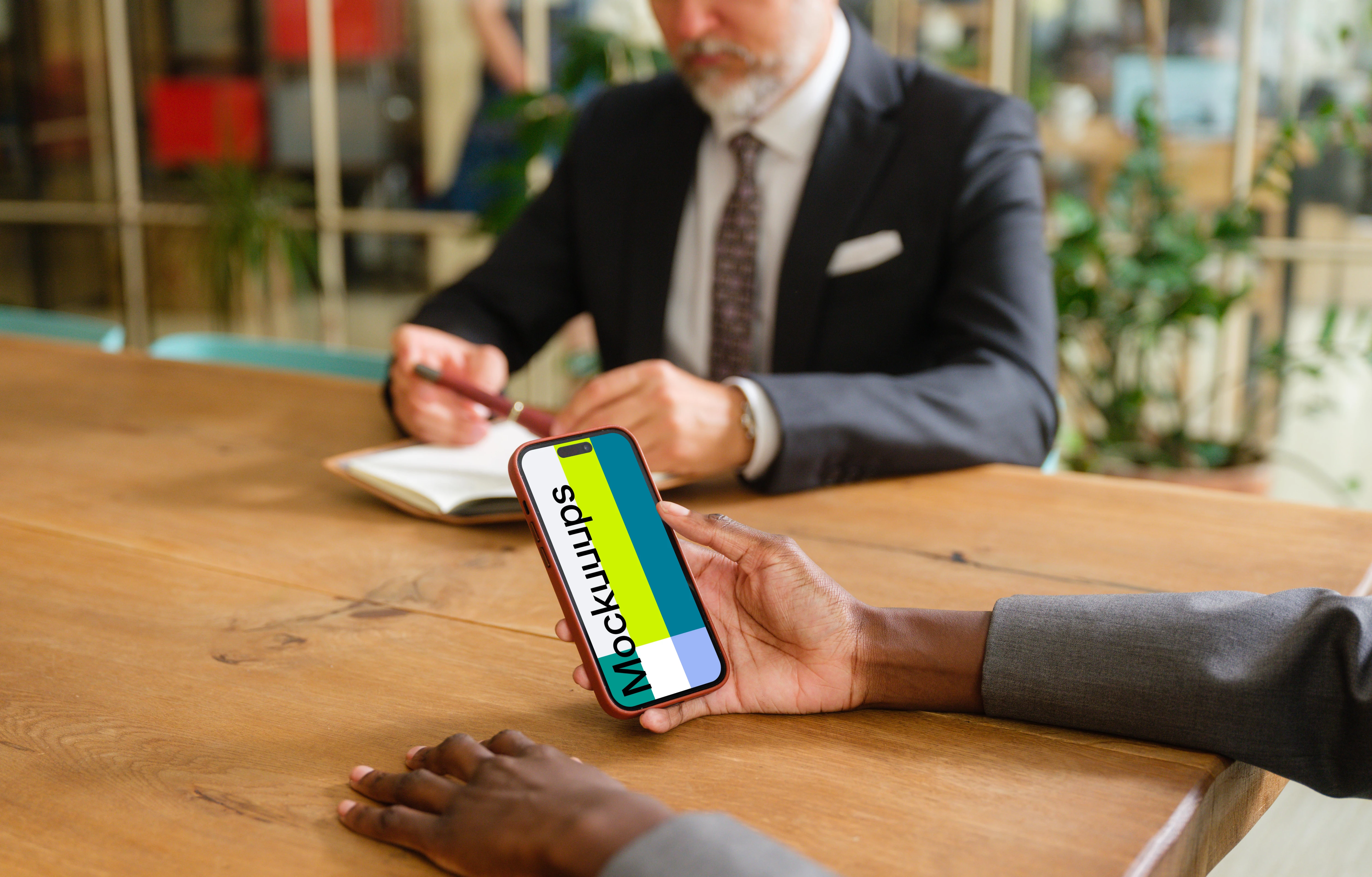 iPhone 14 Pro mockup in businesswoman’s hand