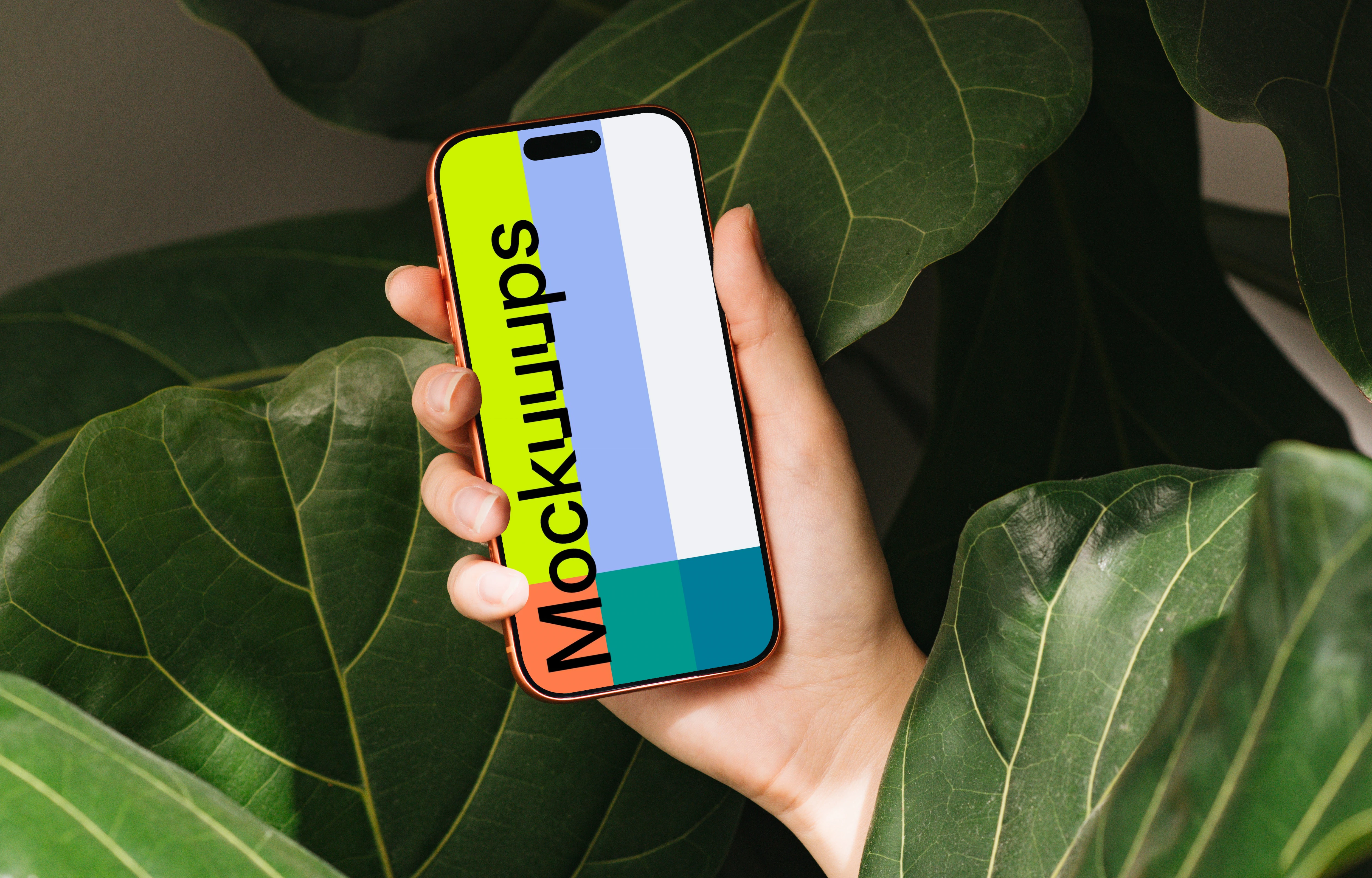iPhone 17 Pro mockup in a hand surrounded by green leaves
