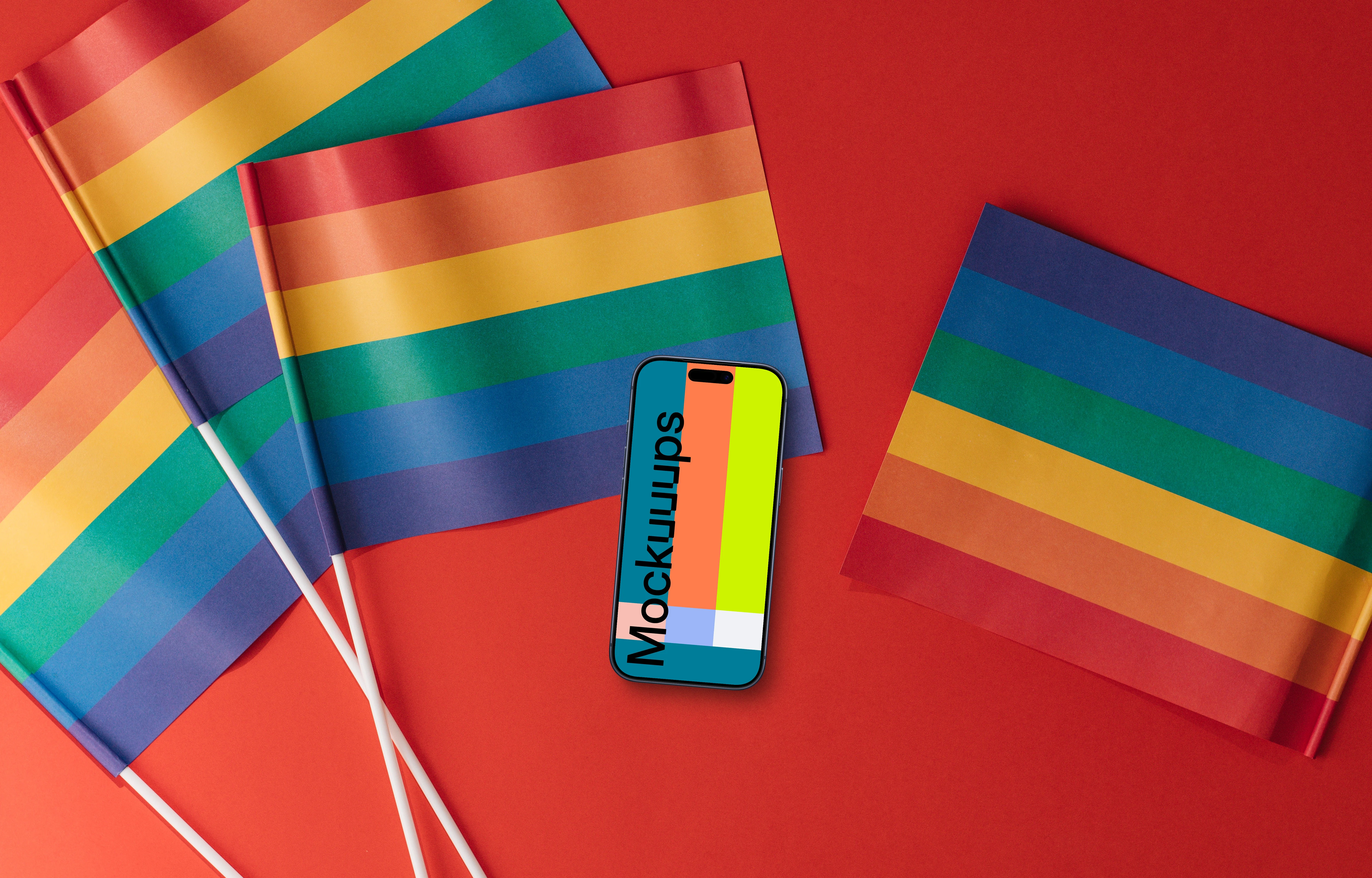 Smartphone mockup on a red surface with LGBT flags around