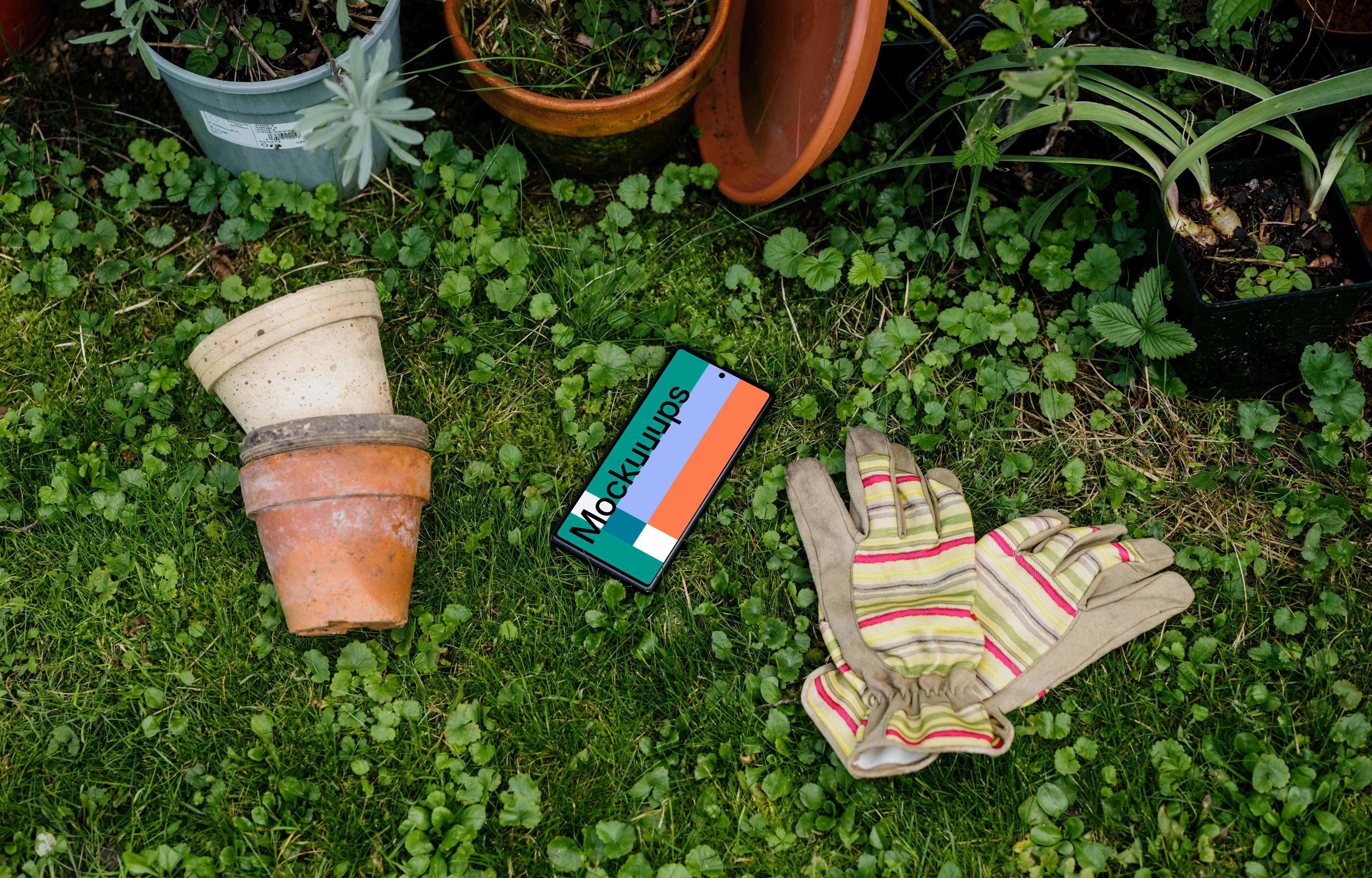Google Pixel 6 mockup placed next to the garden equipment