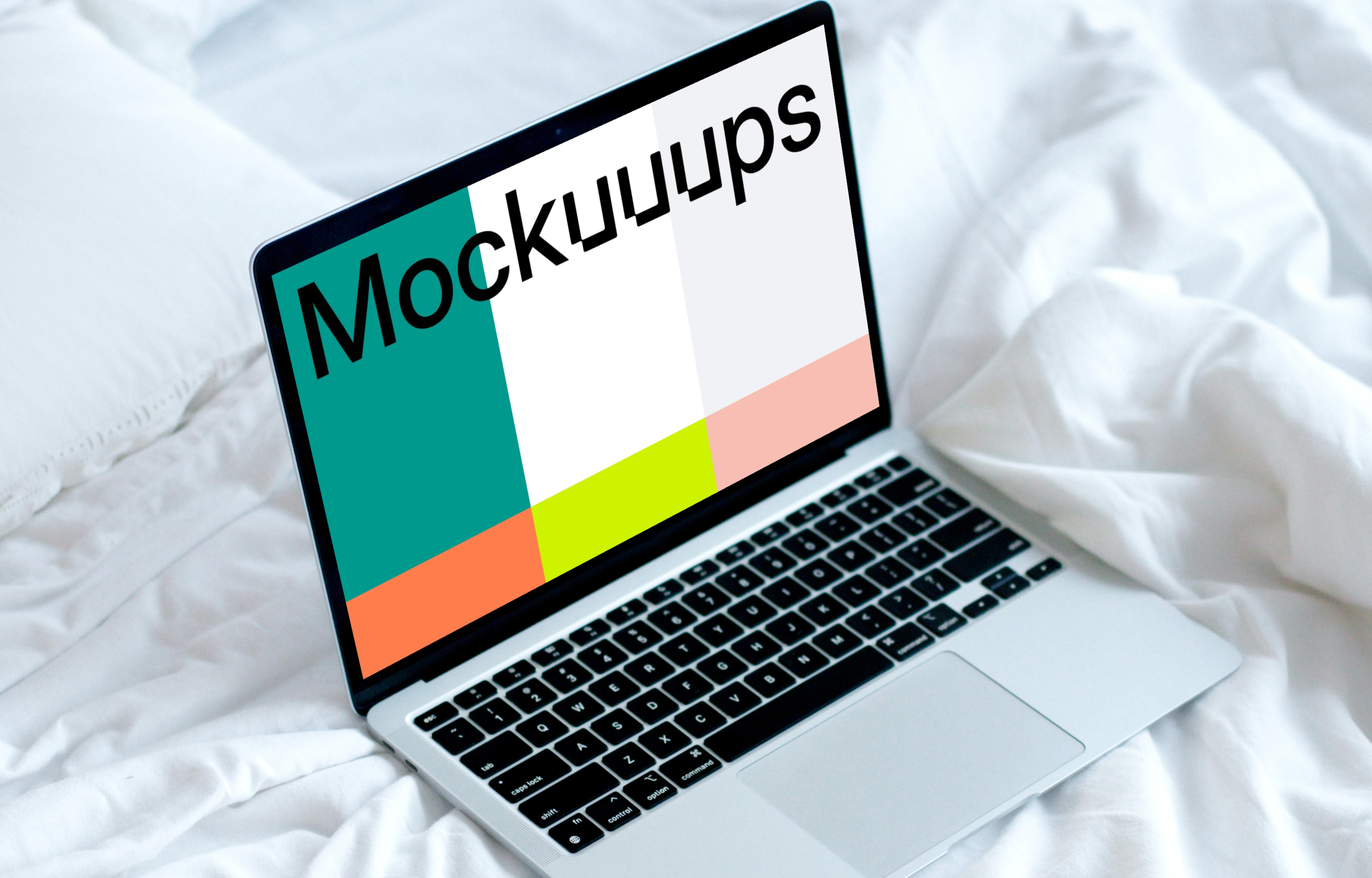 MacBook mockup on a white bed with coffee on a saucer