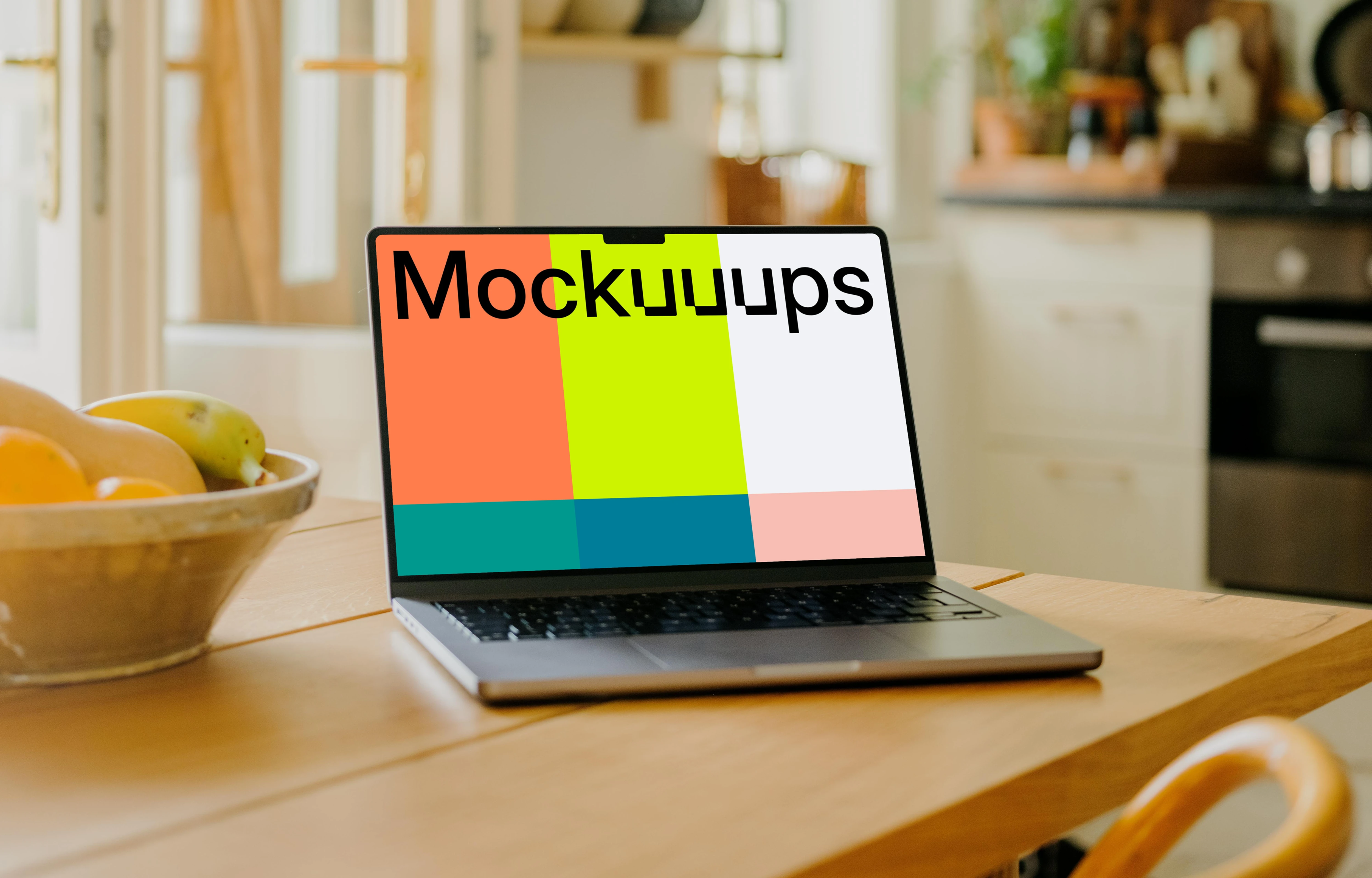 MacBook Pro mockup on a dining table beside a fruit basket