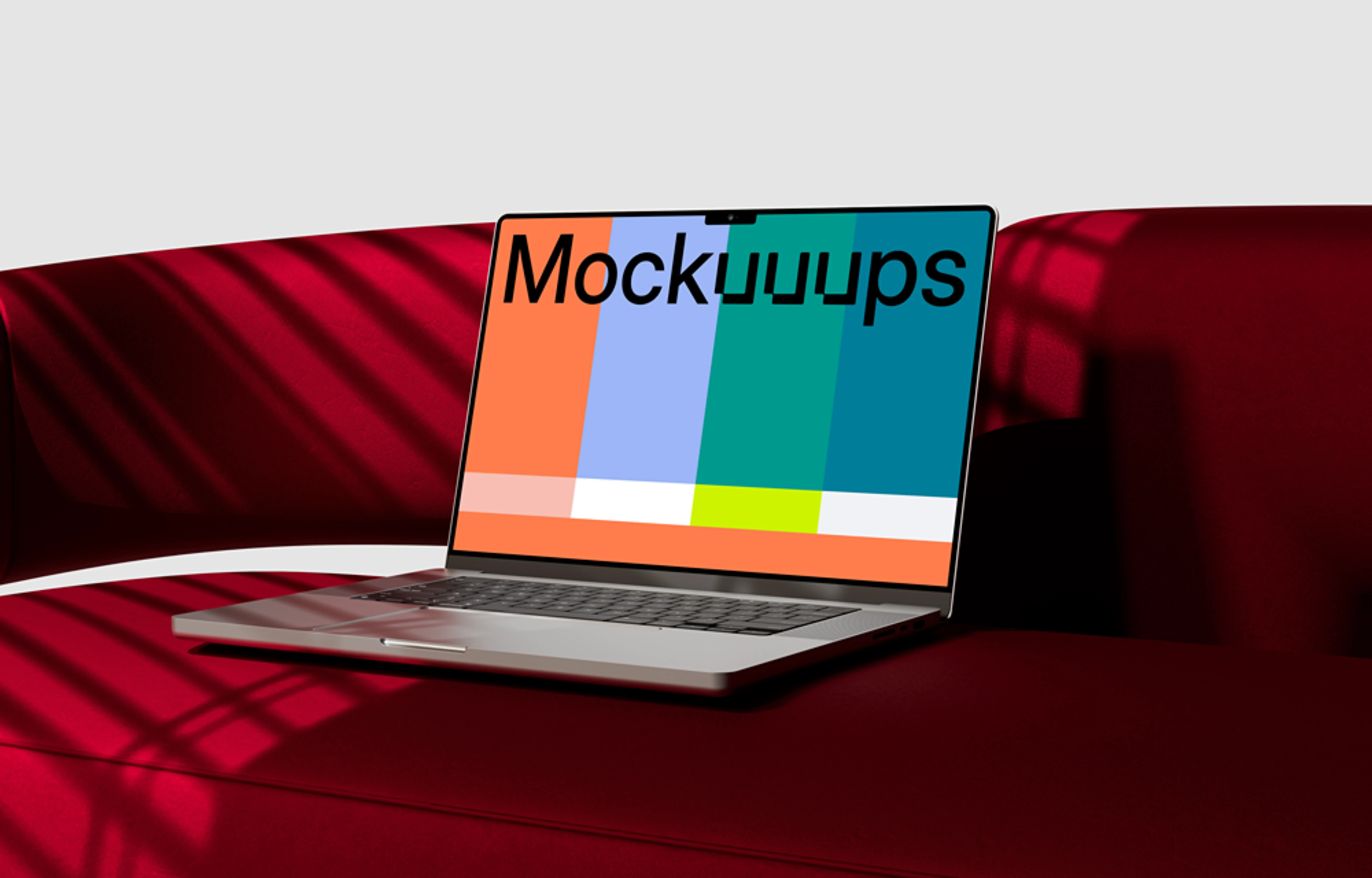 MacBook Pro mockup on a modern red sofa