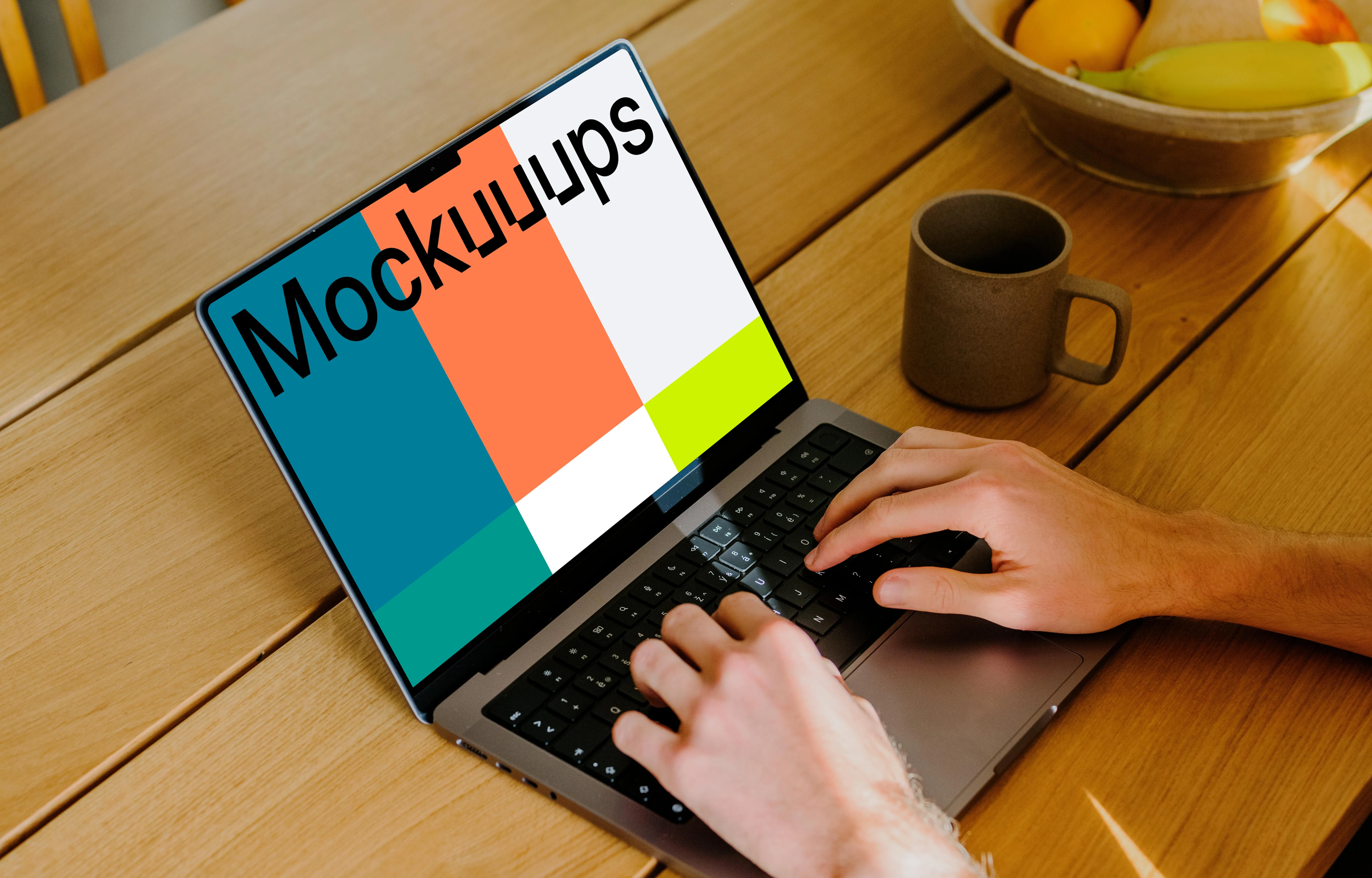 MacBook Pro mockup with a user typing on it.