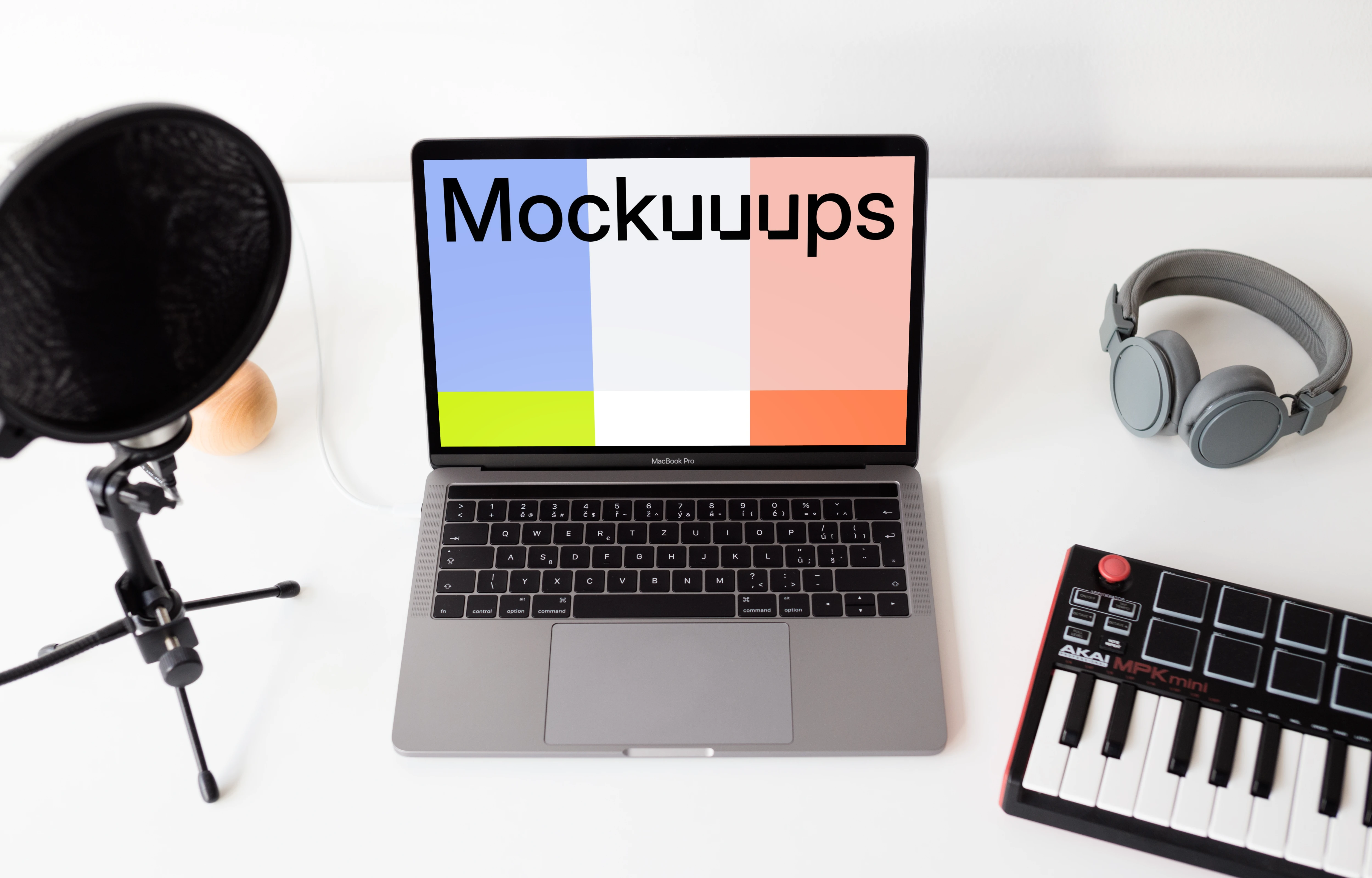 Macbook Pro mockup with touchbar and music equipment
