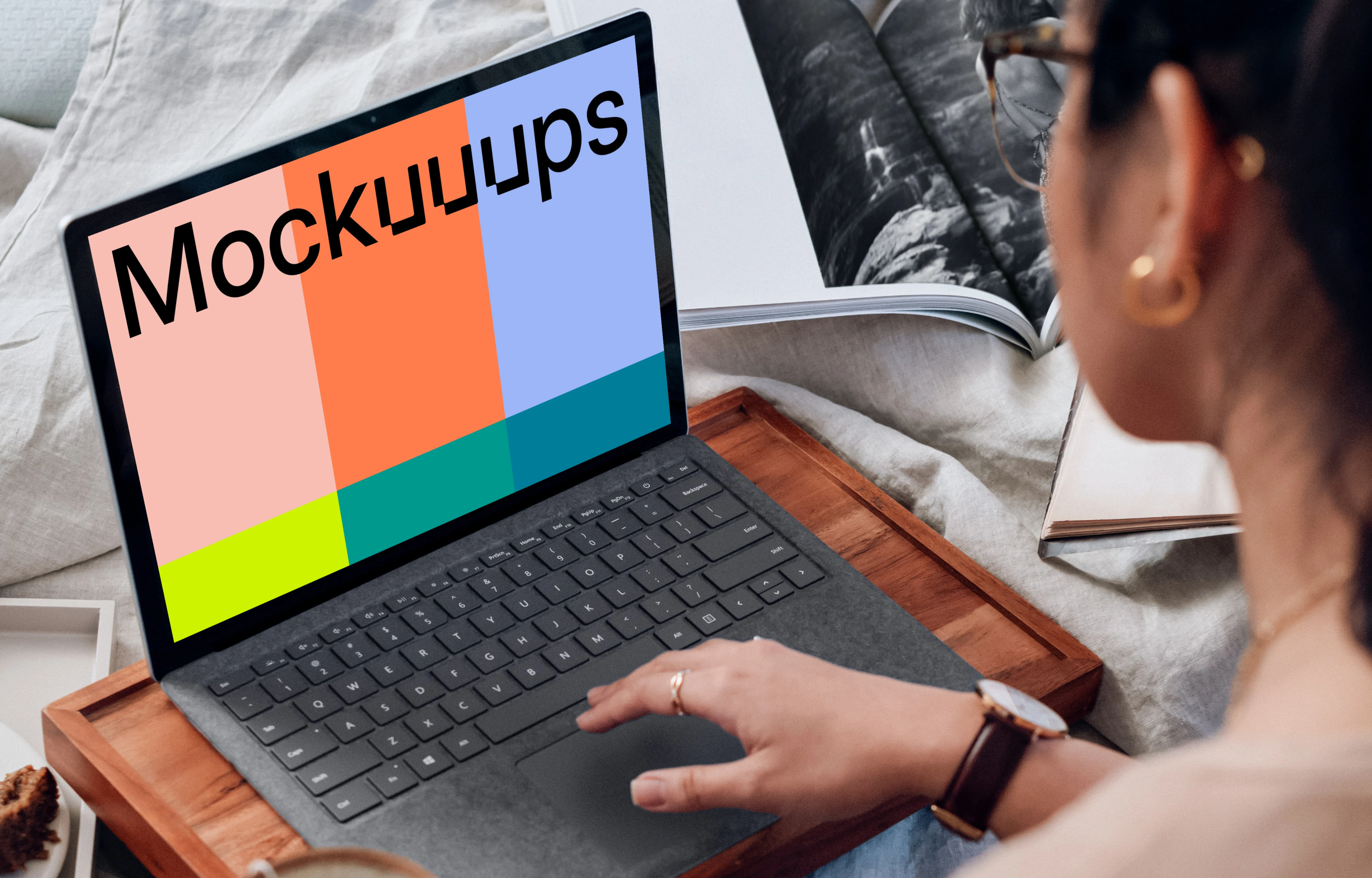 Microsoft Surface Laptop mockup used by a lady on a wooden slab