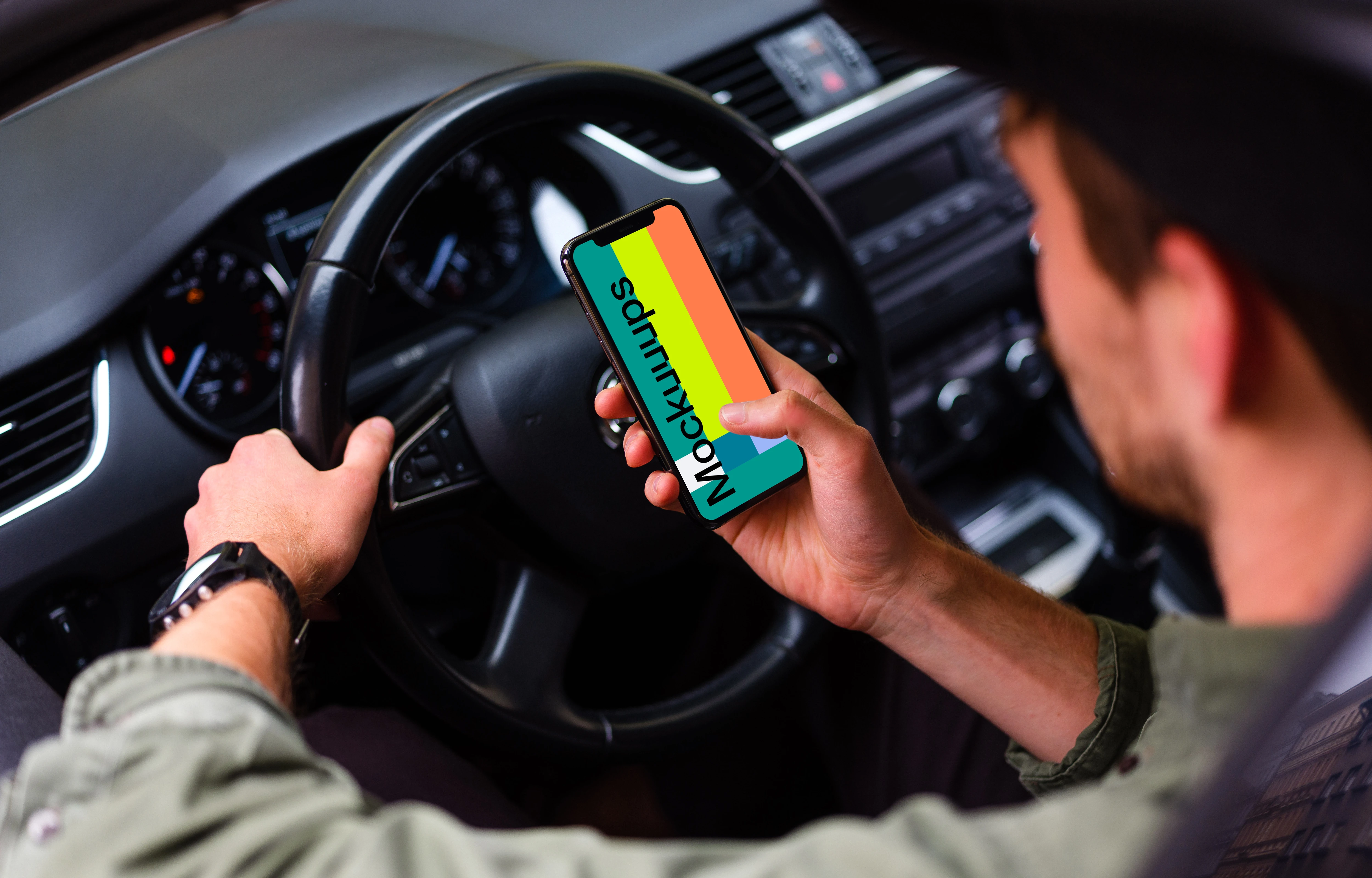 Over the shoulder view of driver tapping iPhone 11 mockup