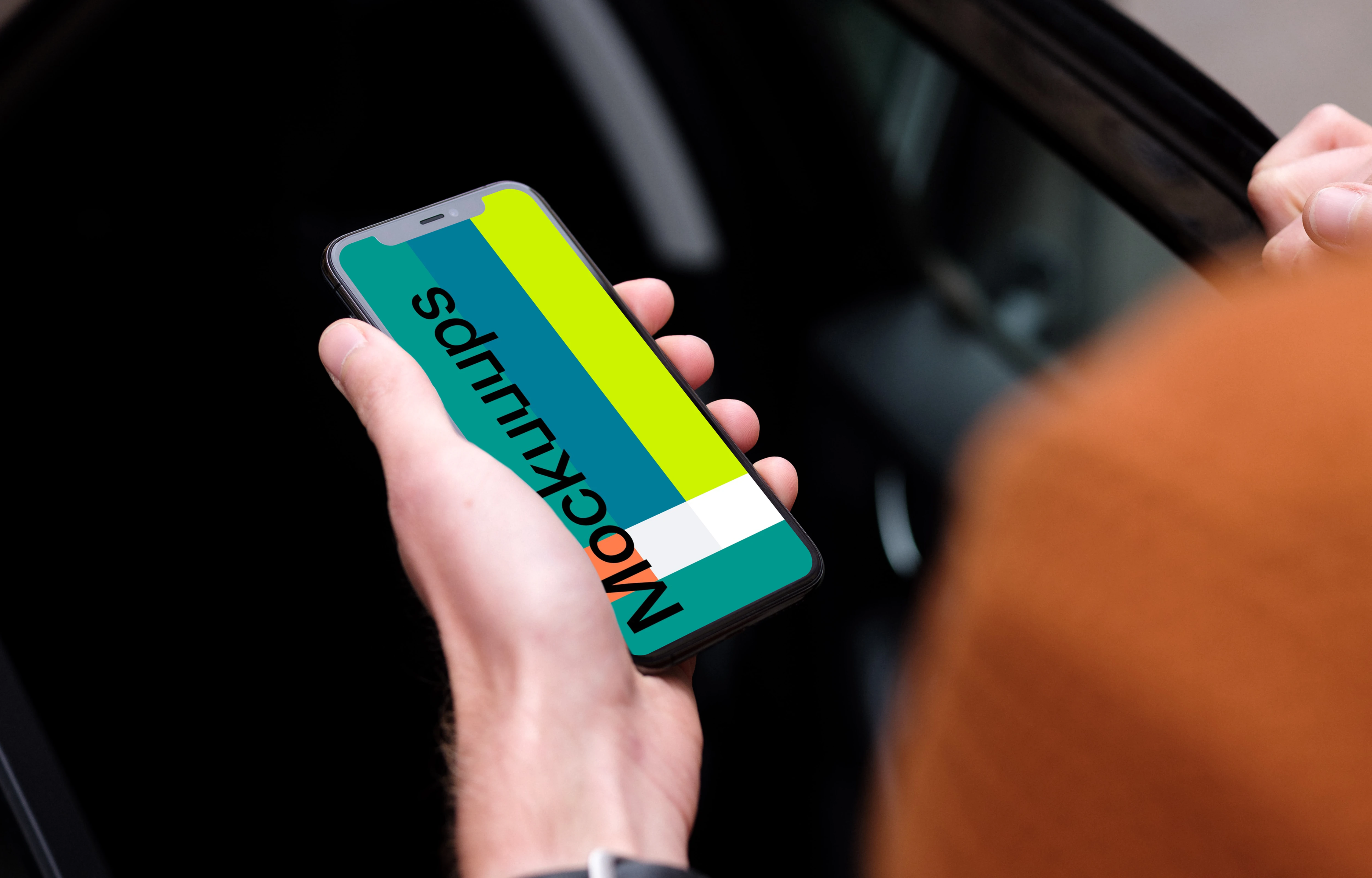 Passenger entering a car holding an iPhone 11 mockup