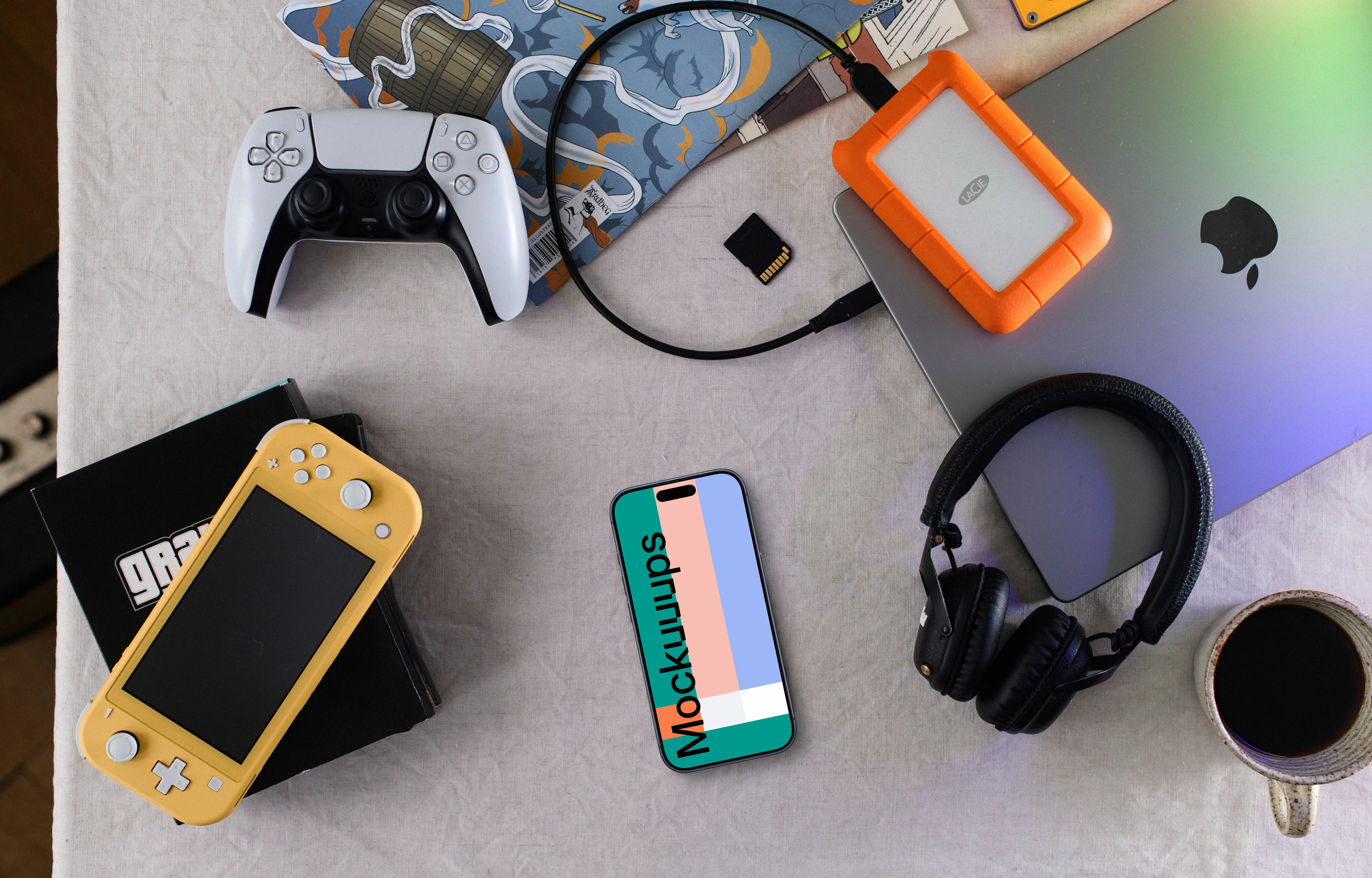 Smartphone mockup with gaming gear on a creative desk