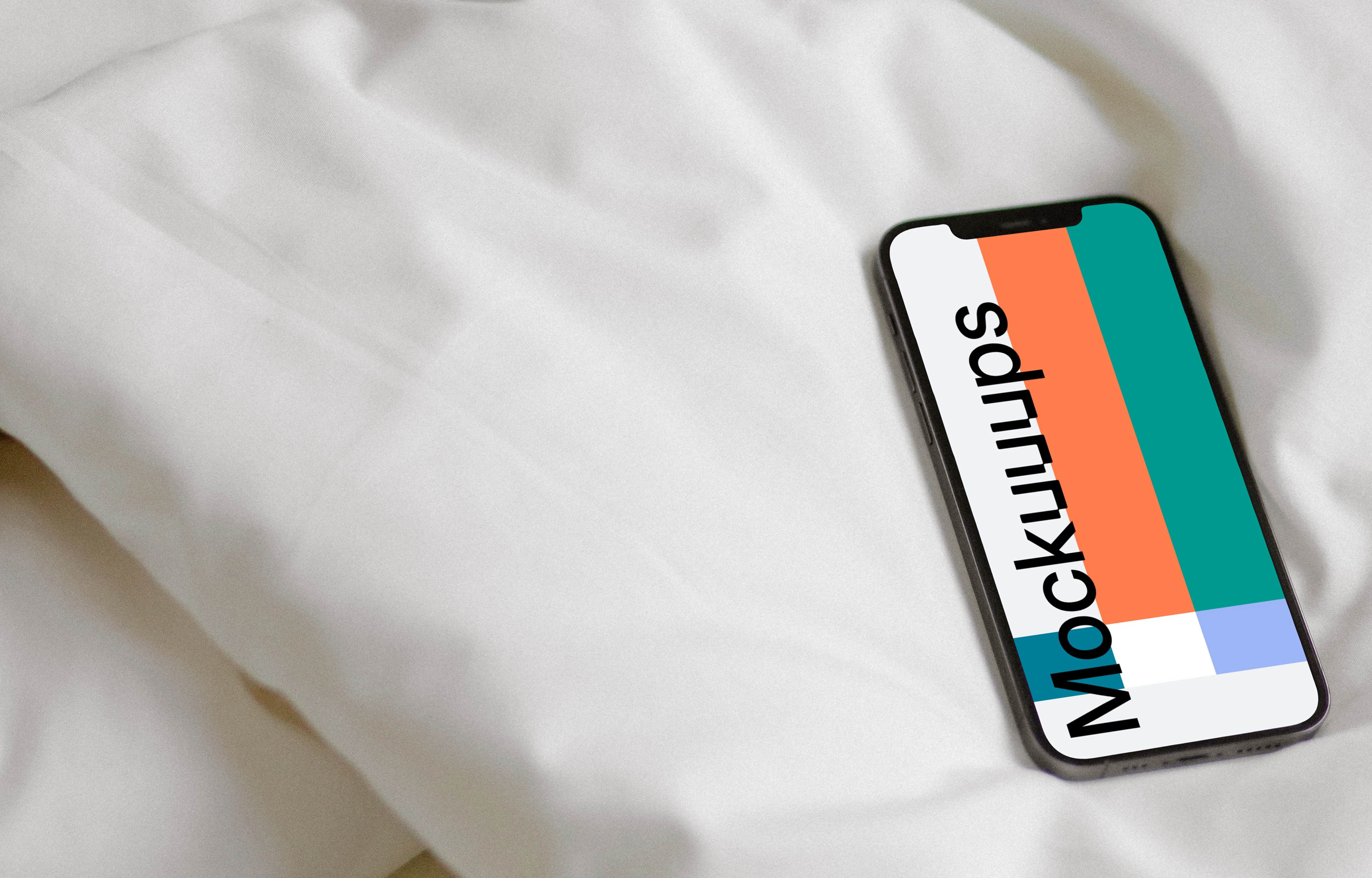 iPhone 12 Pro mockup on a bed